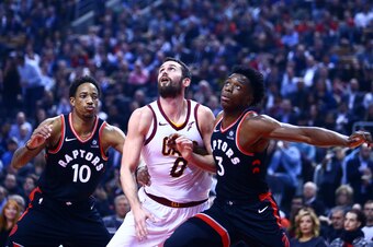 TORONTO, ON - JANUARY 11:  Kevin Love #0 of the Cleveland Cavaliers battles with DeMar DeRozan #10 and OG Anunoby #3 of the Toronto Raptors during the first half of an NBA game at Air Canada Centre on January 11, 2018 in Toronto, Canada.  NOTE TO USER: Us