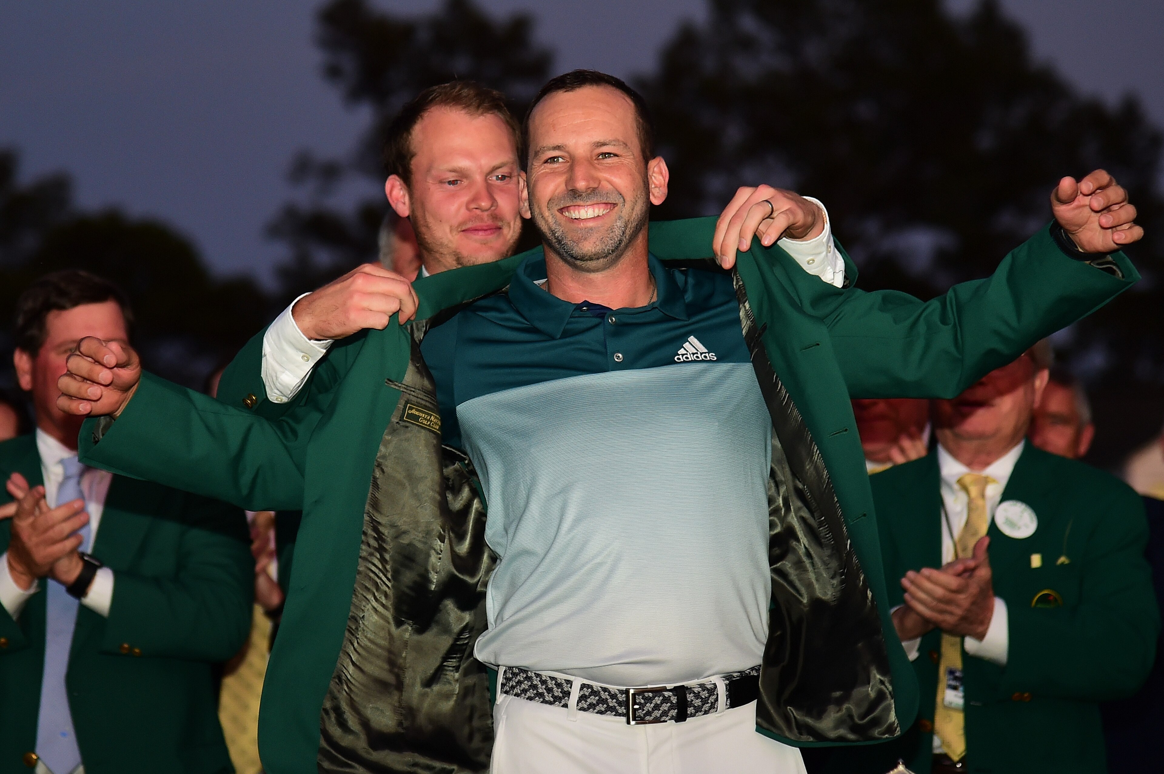 AUGUSTA, GA - APRIL 09:  Danny Willett of England presents Sergio Garcia of Spain with the Green Jacket after Garcia won in a playoff during the final round of the 2017 Masters Tournament at Augusta National Golf Club on April 9, 2017 in Augusta, Georgia.