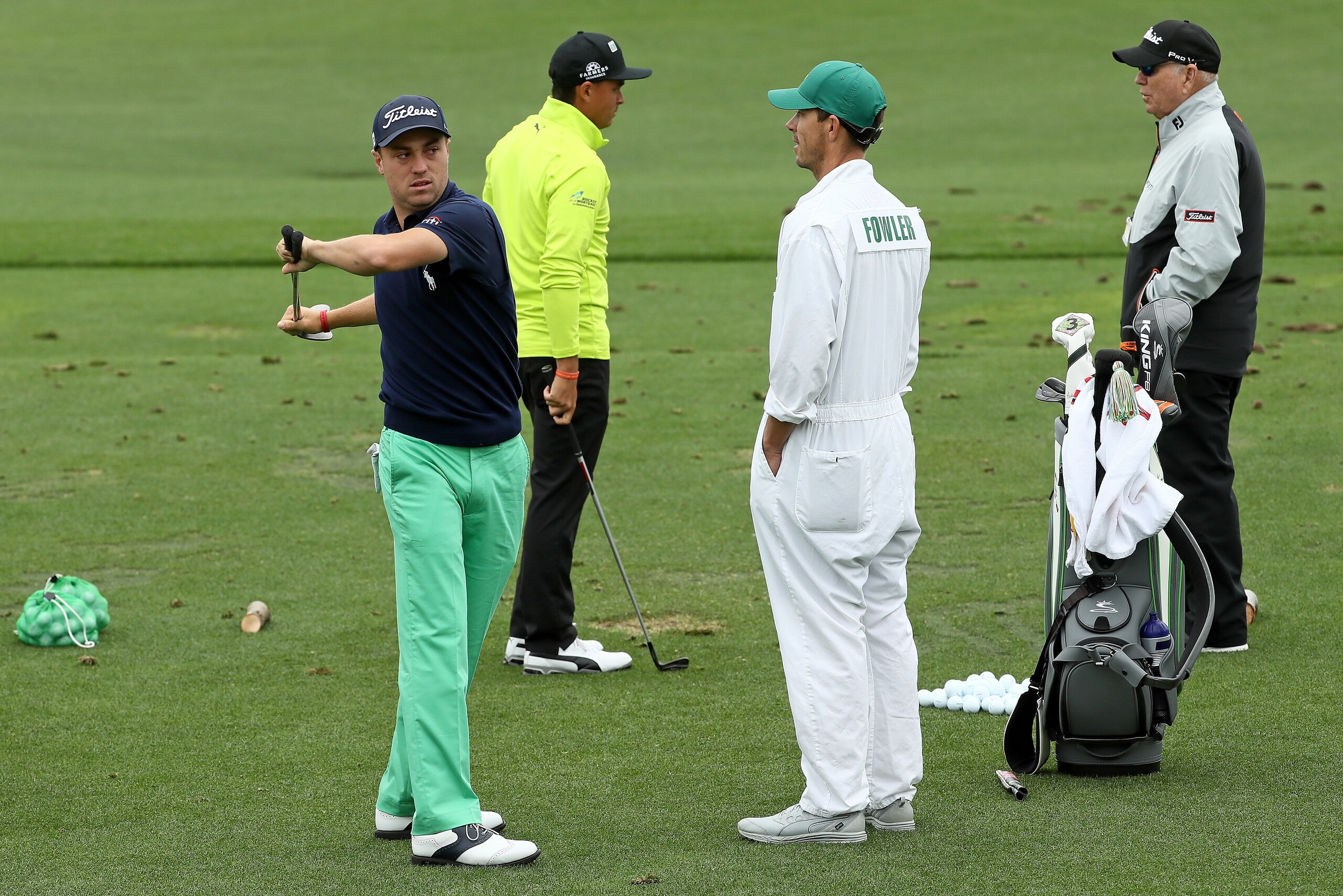 AUGUSTA, GA - APRIL 04: Justin Thomas of the United States, Rickie Fowler of the United States, caddie Joe Skovron and coach Butch Harmon are seen on the practice range during a practice round prior to the start of the 2018 Masters Tournament at Augusta N AUGUSTA, GA - APRIL 04: Justin Thomas of the United States, Rickie Fowler of the United States, caddie Joe Skovron and coach Butch Harmon are seen on the practice range during a practice round prior to the start of the 2018 Masters Tournament at Augusta N