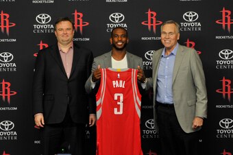HOUSTON, TX  - JULY 14: General Manager Daryl Morey of the Houston Rockets, Chris Paul and Head Coach Mike D'Antoni poses for a photo during a press conference on July 14, 2017 at the Toyota Center in Houston, Texas. NOTE TO USER: User expressly acknowled
