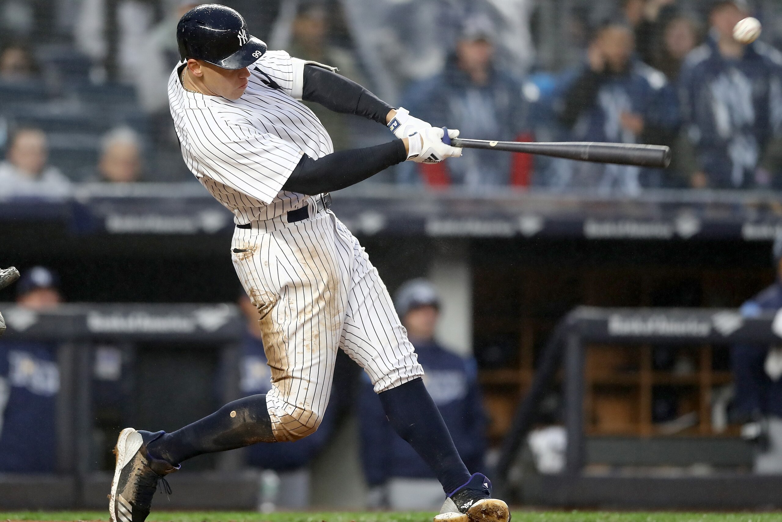 NEW YORK, NY - APRIL 03:  Aaron Judge #99 of the New York Yankees hits a single in the seventh inning against the Tampa Bay Rays during Opening Day at Yankee Stadium on April 3, 2018 in the Bronx borough of New York City.  (Photo by Elsa/Getty Images)