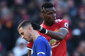 Manchester United's French midfielder Paul Pogba (R) gestures to Chelsea's Belgian midfielder Eden Hazard as Hazard is substituted during the English Premier League football match between Manchester United and Chelsea at Old Trafford in Manchester, north 