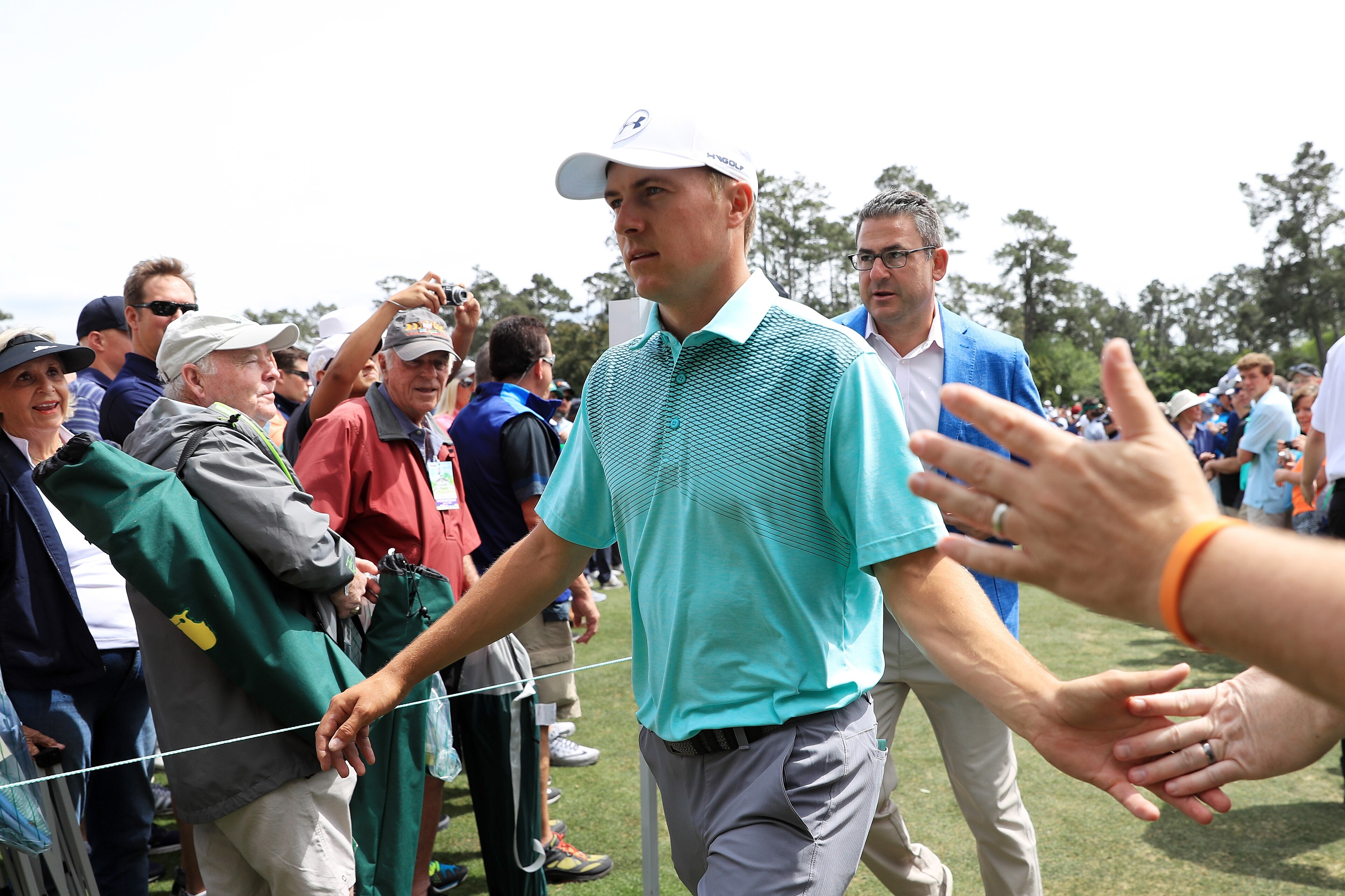 AUGUSTA, GA - APRIL 04:  Jordan Spieth of the United States high fives patrons during a practice round prior to the start of the 2018 Masters Tournament at Augusta National Golf Club on April 4, 2018 in Augusta, Georgia.  (Photo by Andrew Redington/Getty 