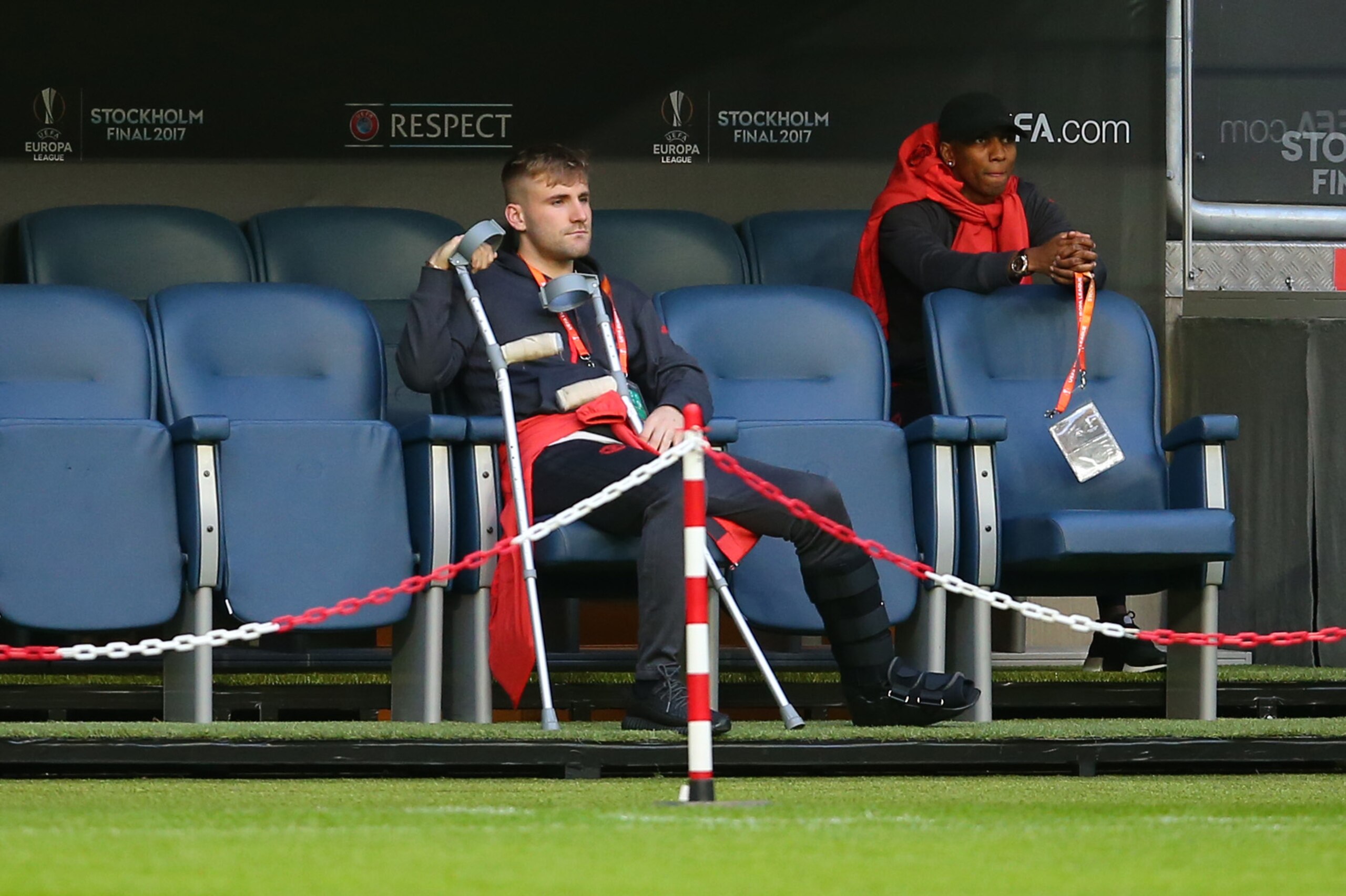 STOCKHOLM, SWEDEN - MAY 23:  An injured Luke Shaw and Ashley Young with crutches sit on the bench as the team walk around ahead of Wednesday's UEFA Europa League Final at Friends Arena on May 23, 2017 in Stockholm, Sweden. (Photo by Catherine Ivill - AMA/