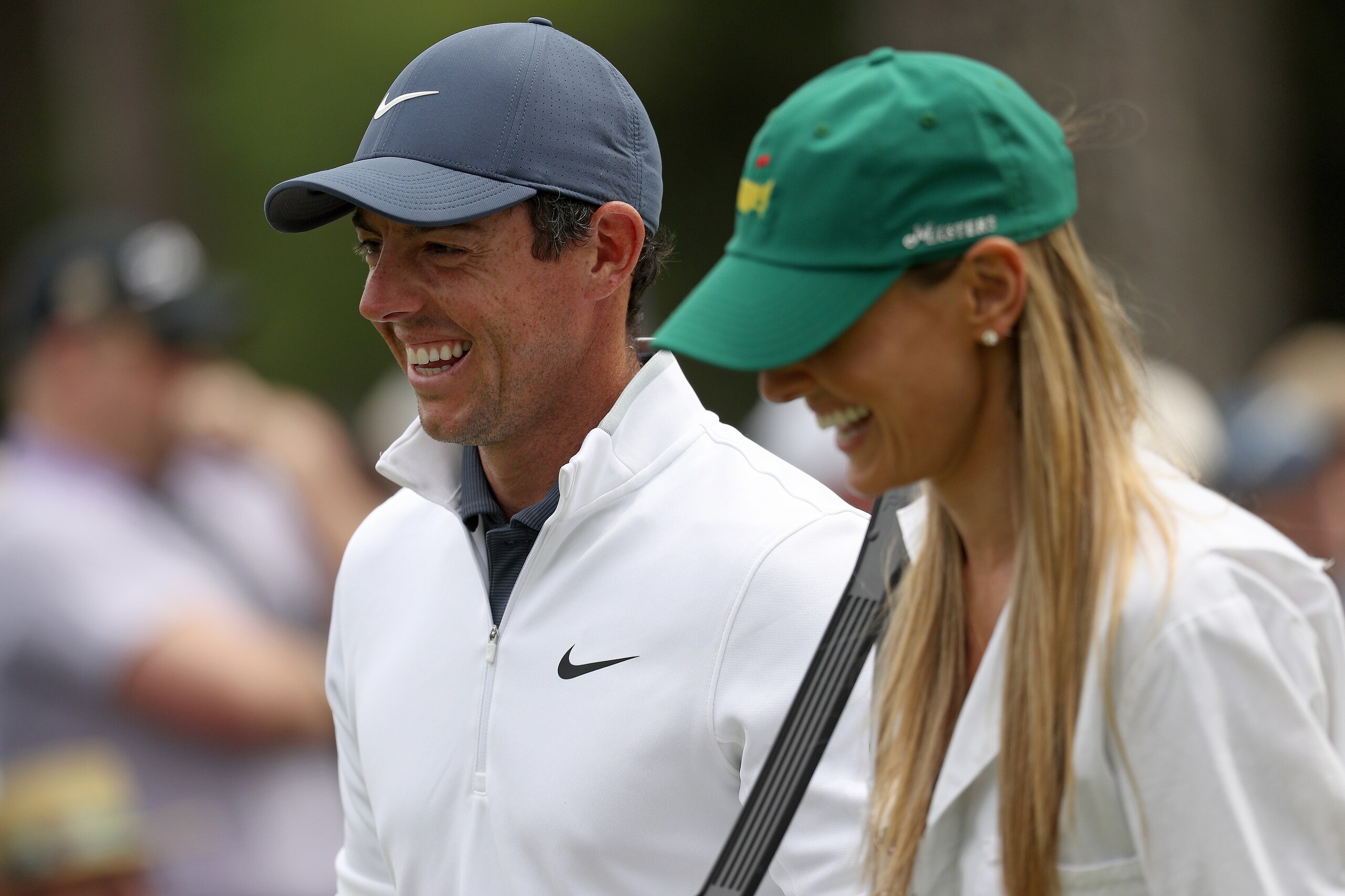 AUGUSTA, GA - APRIL 04:  Rory McIlroy of Northern Ireland laughs with his wife Erica during the Par 3 Contest prior to the start of the 2018 Masters Tournament at Augusta National Golf Club on April 4, 2018 in Augusta, Georgia.  (Photo by Patrick Smith/Ge