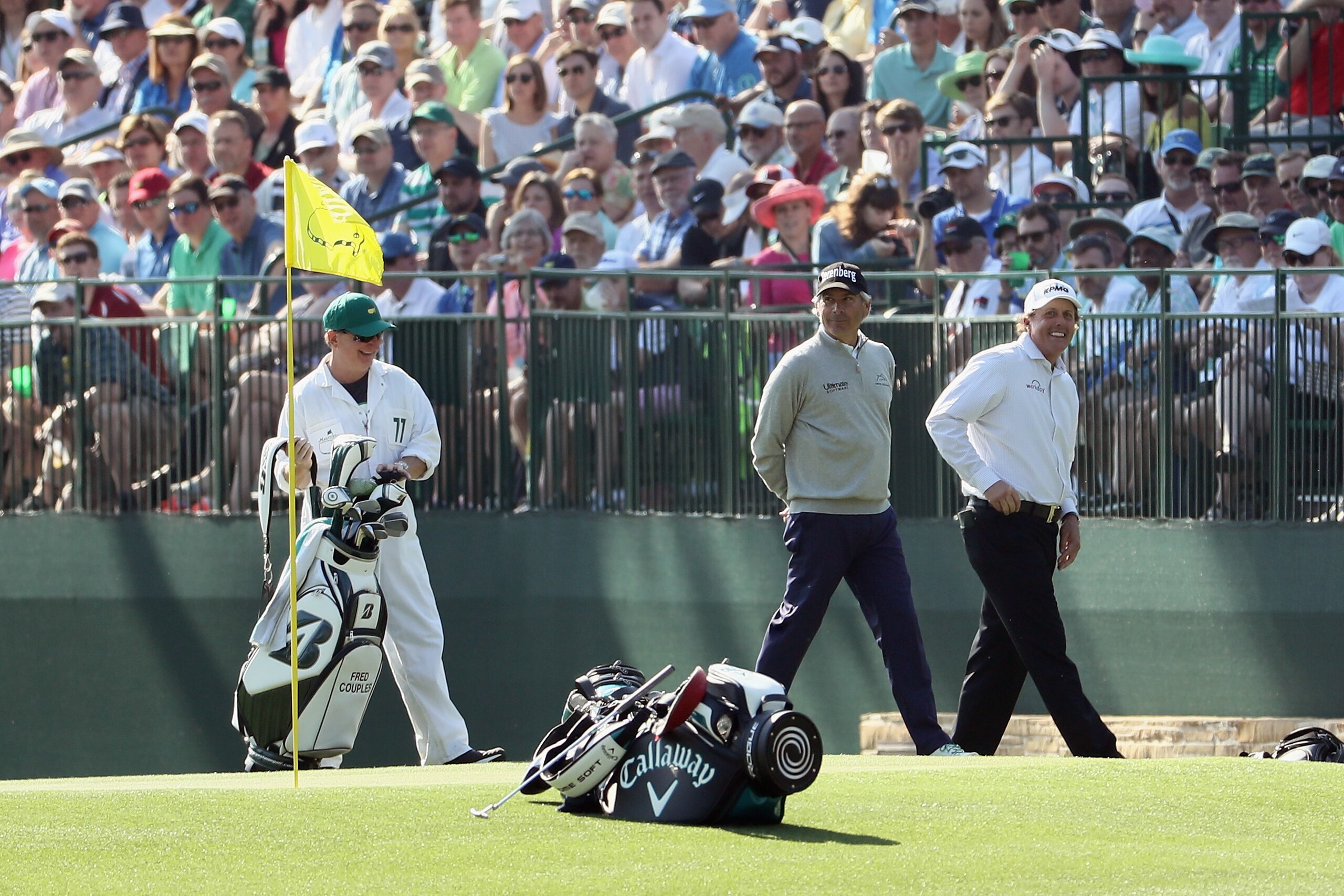 AUGUSTA, GA - APRIL 03: Phil Mickelson of the United States and Fred Couples of the United States walk across a green during a practice round prior to the start of the 2018 Masters Tournament at Augusta National Golf Club on April 3, 2018 in Augusta, Geor