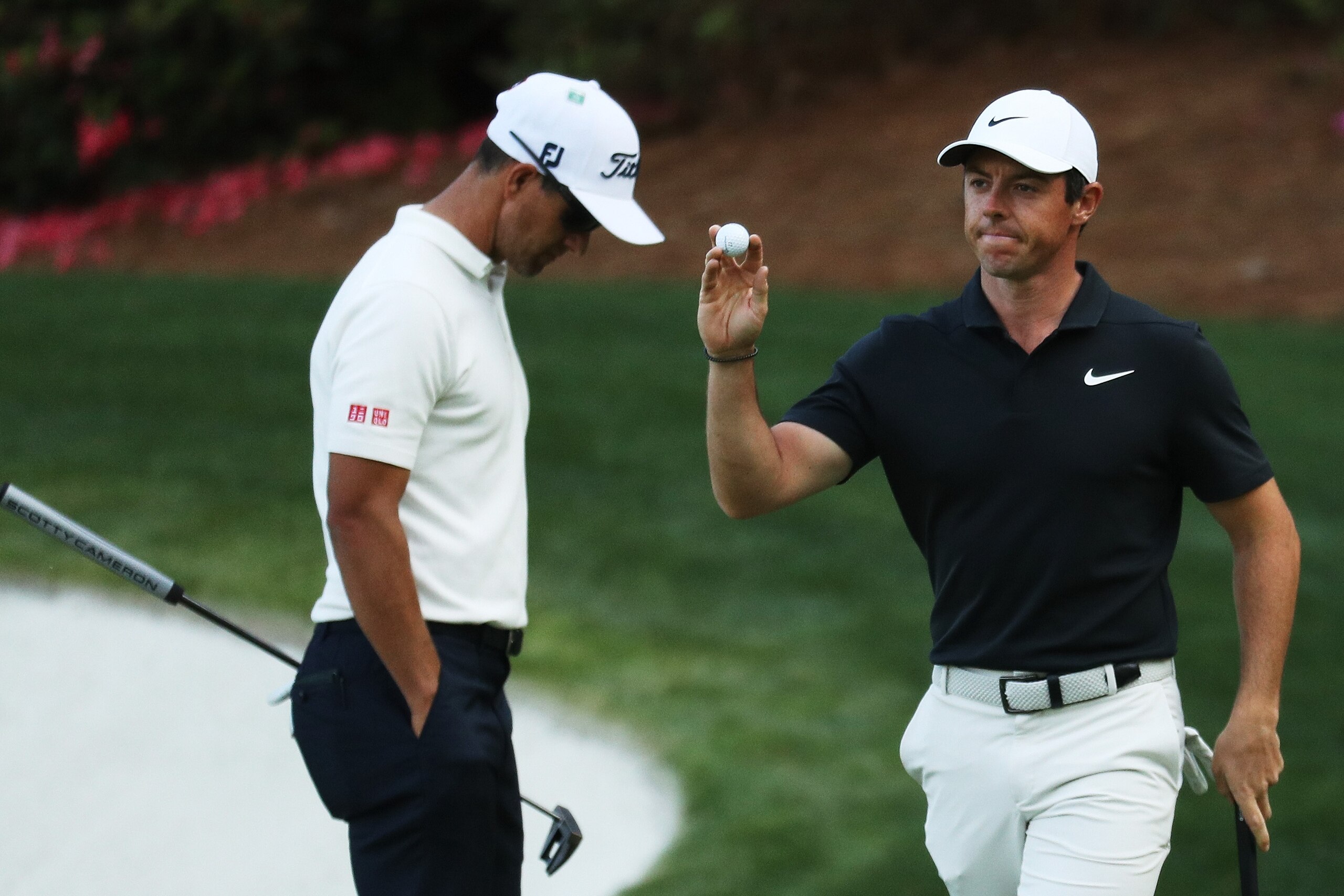 AUGUSTA, GA - APRIL 05:  Rory McIlroy of Northern Ireland waves on the 13th hole alongside Adam Scott of Australia during the first round of the 2018 Masters Tournament at Augusta National Golf Club on April 5, 2018 in Augusta, Georgia.  (Photo by Patrick