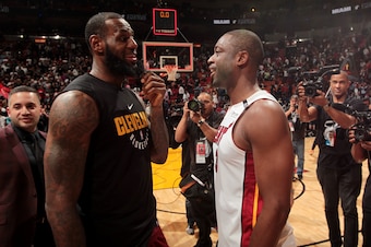MIAMI, FL - MARCH 27:  LeBron James #23 of the Cleveland Cavaliers and Dwyane Wade #3 of the Miami Heat meet after the game between the two teams on March 27, 2018 at American Airlines Arena in Miami, Florida. NOTE TO USER: User expressly acknowledges and