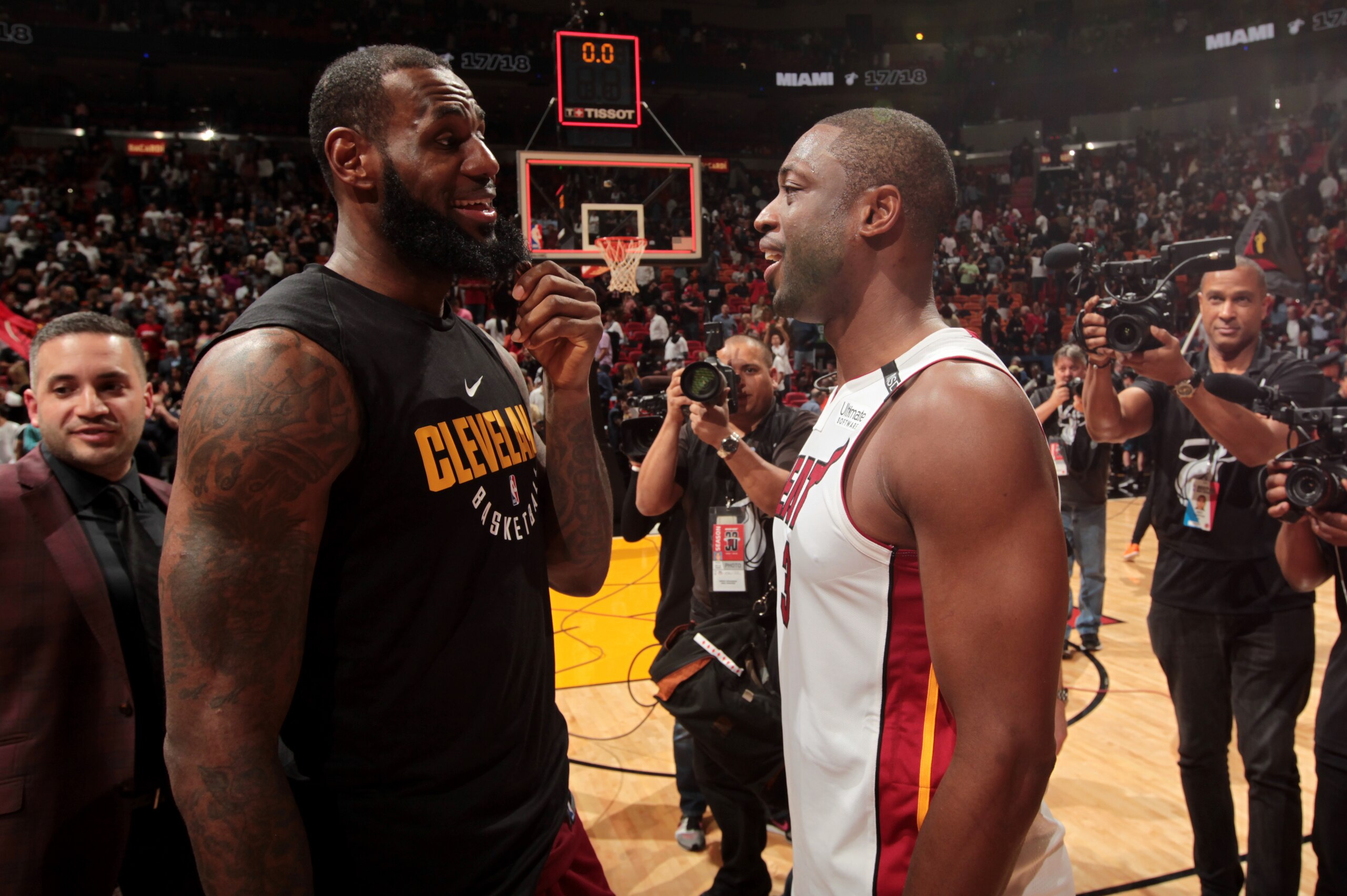 MIAMI, FL - MARCH 27:  LeBron James #23 of the Cleveland Cavaliers and Dwyane Wade #3 of the Miami Heat meet after the game between the two teams on March 27, 2018 at American Airlines Arena in Miami, Florida. NOTE TO USER: User expressly acknowledges and