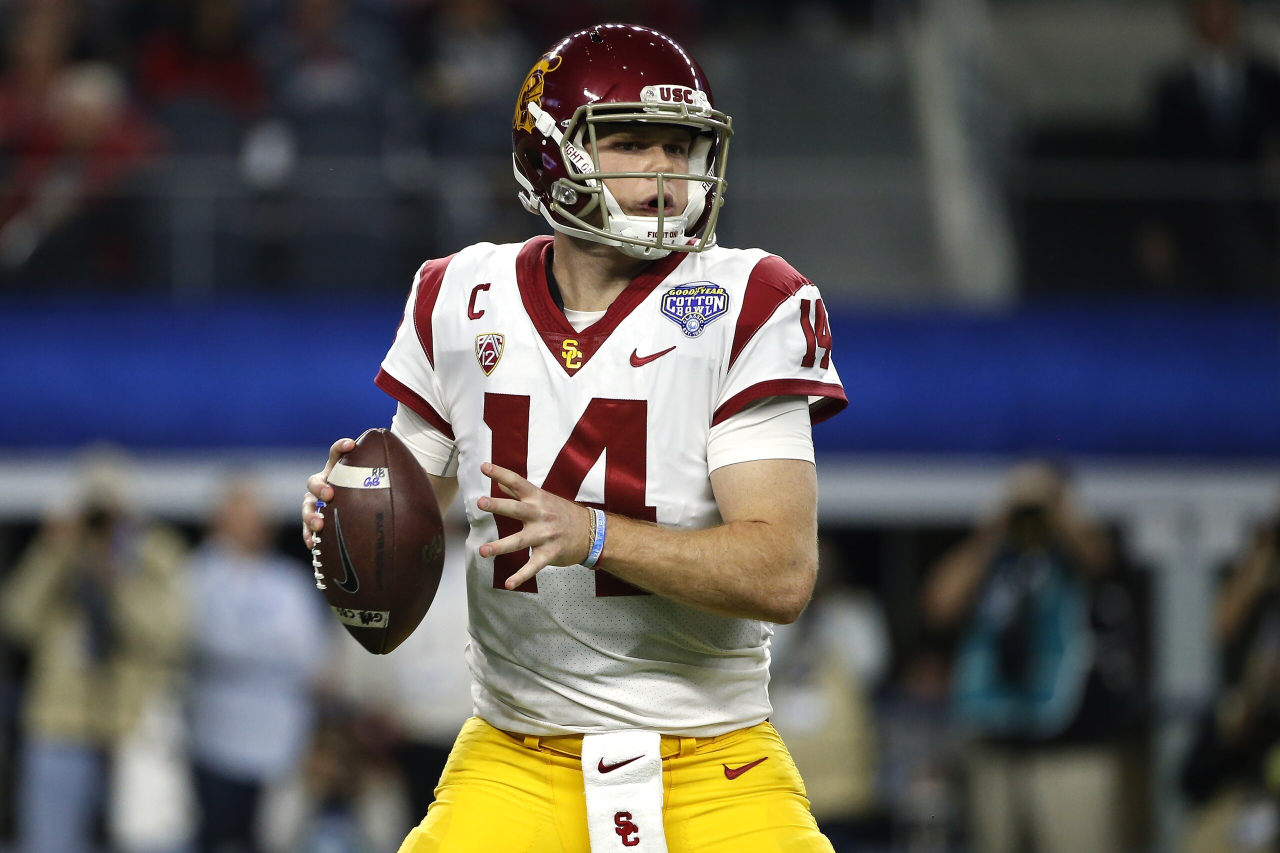 ARLINGTON, TX - DECEMBER 29: Sam Darnold #14 of the USC Trojans looks to throw against the Ohio State Buckeyes in the first half of the 82nd Goodyear Cotton Bowl Classic between USC and Ohio State at AT&T Stadium on December 29, 2017 in Arlington, Texas. 