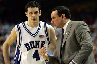 JJ Redick receives advice from Mike Krzyzewski while at Duke, where Redick starred as a rare NBA prospect staying through his senior year.