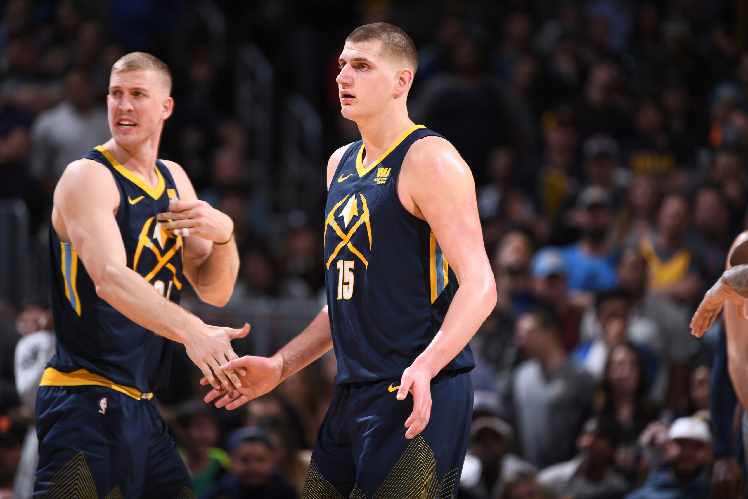 DENVER, CO - APRIL 1: Nikola Jokic #15 of the Denver Nuggets high-fives Mason Plumlee #24 of the Denver Nuggets during the game against the Minnesota Timberwolves on April 5, 2018 at the Pepsi Center in Denver, Colorado. NOTE TO USER: User expressly ackn DENVER, CO - APRIL 1: Nikola Jokic #15 of the Denver Nuggets high-fives Mason Plumlee #24 of the Denver Nuggets during the game against the Minnesota Timberwolves on April 5, 2018 at the Pepsi Center in Denver, Colorado. NOTE TO USER: User expressly ackn