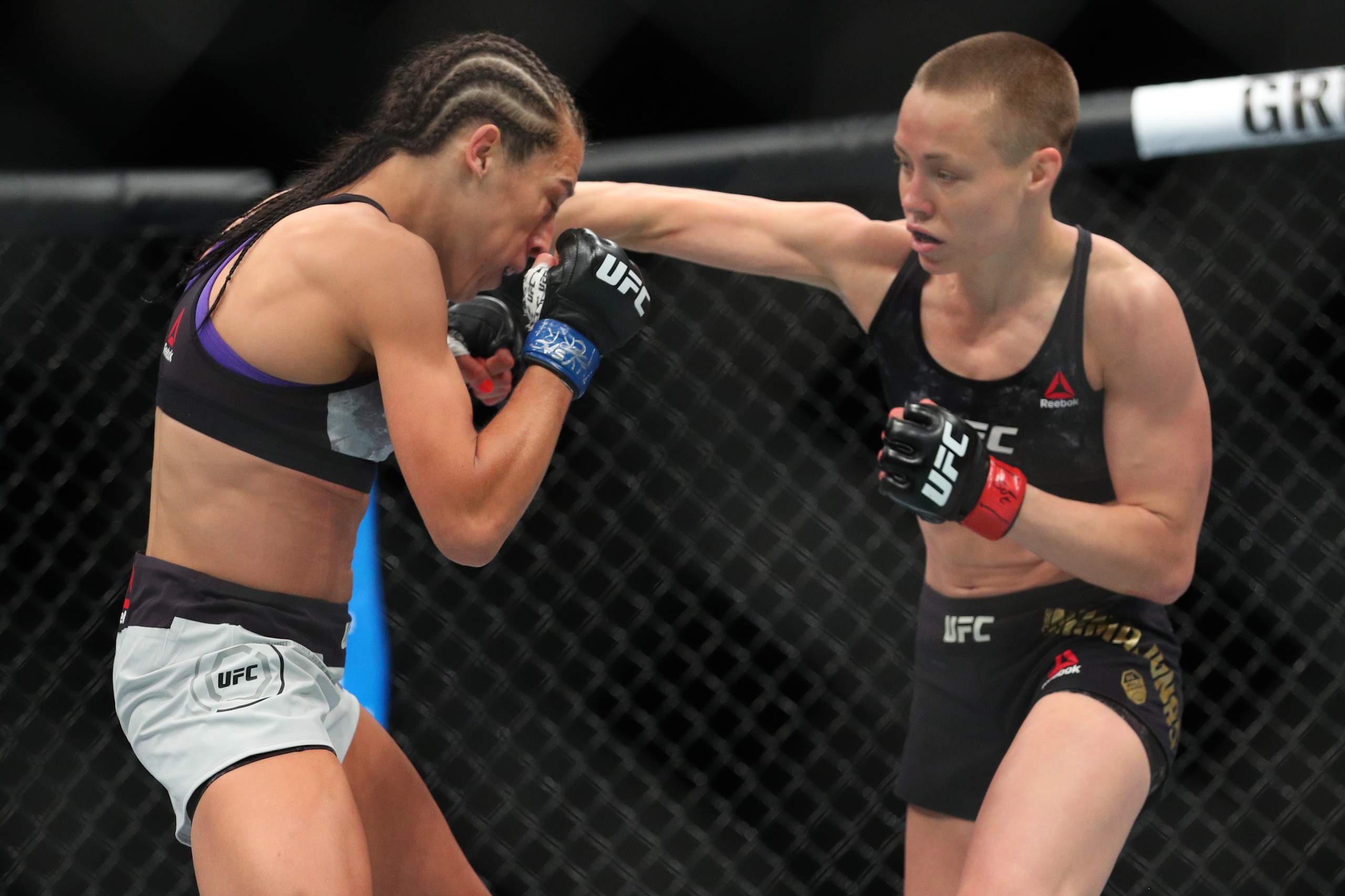 NEW YORK, NY - APRIL 07: UFC strawweight champion Rose Namajunas (R) throws a right hand at Joanna Jedrzejczyk (L) during their UFC women's strawweight championship bout at UFC 223 at Barclays Center on April 7, 2018 in New York City. (Photo by Ed Mulholl