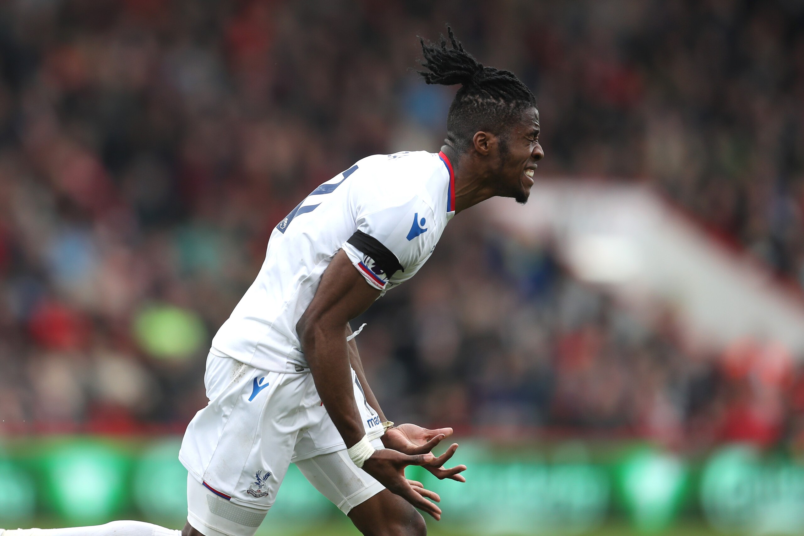BOURNEMOUTH, ENGLAND - APRIL 07: Wilfried Zaha of Crystal Palace celebrates after scoring his sides second goal during the Premier League match between AFC Bournemouth and Crystal Palace at Vitality Stadium on April 7, 2018 in Bournemouth, England. (Pho BOURNEMOUTH, ENGLAND - APRIL 07: Wilfried Zaha of Crystal Palace celebrates after scoring his sides second goal during the Premier League match between AFC Bournemouth and Crystal Palace at Vitality Stadium on April 7, 2018 in Bournemouth, England. (Pho