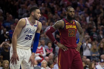 PHILADELPHIA, PA - APRIL 6: Ben Simmons #25 of the Philadelphia 76ers and LeBron James #23 of the Cleveland Cavaliers look on during foul shots at the Wells Fargo Center on April 6, 2018 in Philadelphia, Pennsylvania. NOTE TO USER: User expressly acknowle