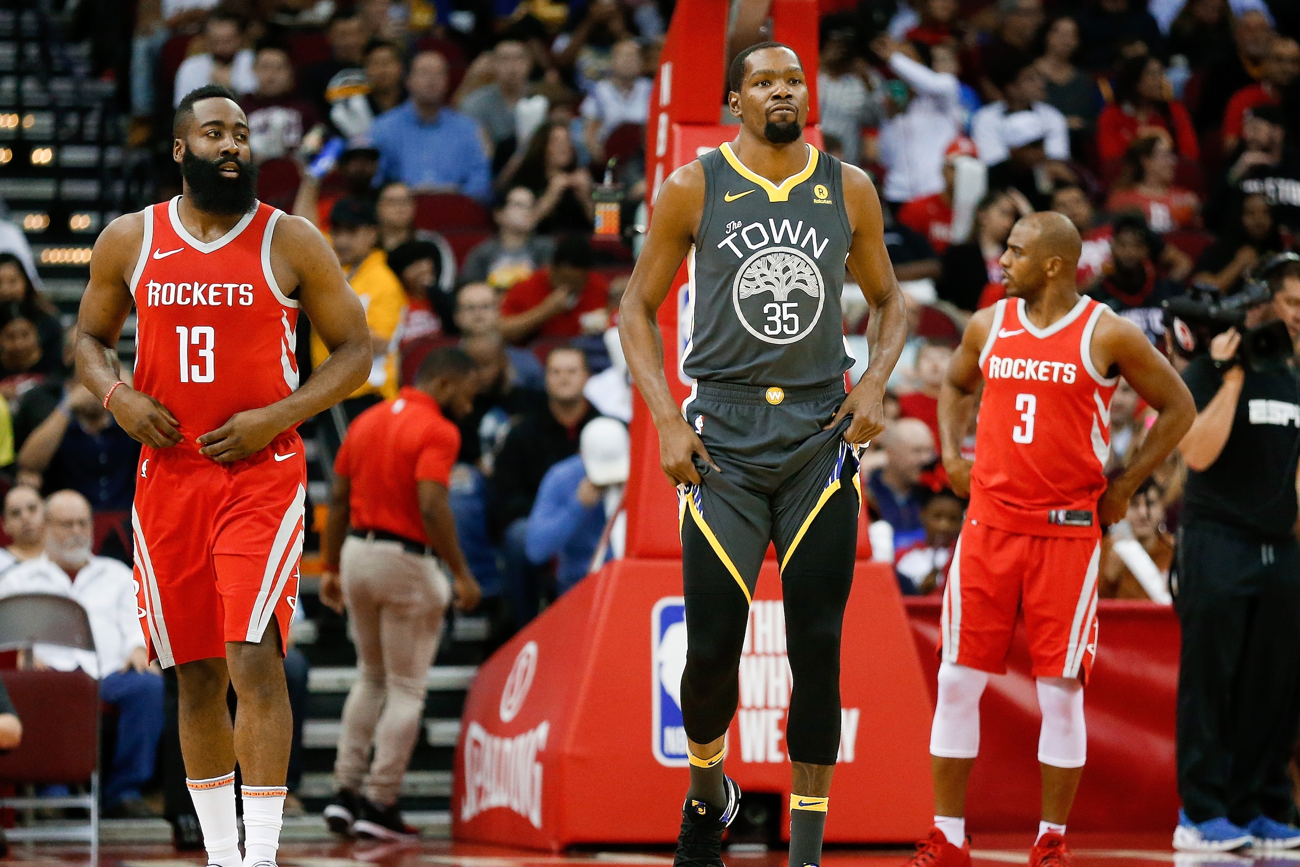 HOUSTON, TX - JANUARY 20:   James Harden #13 of the Houston Rockets, Kevin Durant #35 of the Golden State Warriors and Chris Paul #3 of the Houston Rockets at Toyota Center on January 20, 2018 in Houston, Texas. NOTE TO USER: User expressly acknowledges a