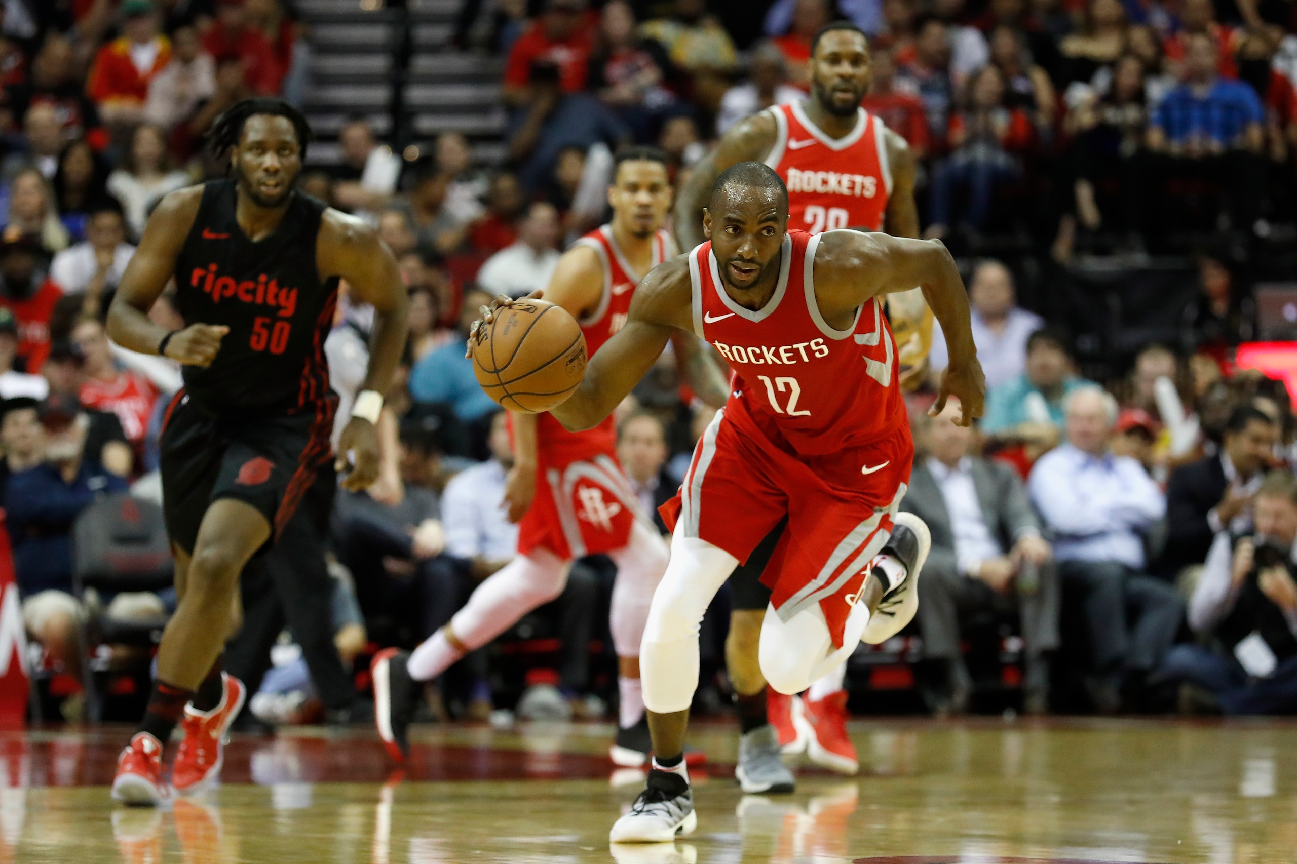 HOUSTON, TX - APRIL 05:  Luc Mbah a Moute #12 of the Houston Rockets dribbles the ball on a fast break in the second half against the Portland Trail Blazers at Toyota Center on April 5, 2018 in Houston, Texas.  NOTE TO USER: User expressly acknowledges an