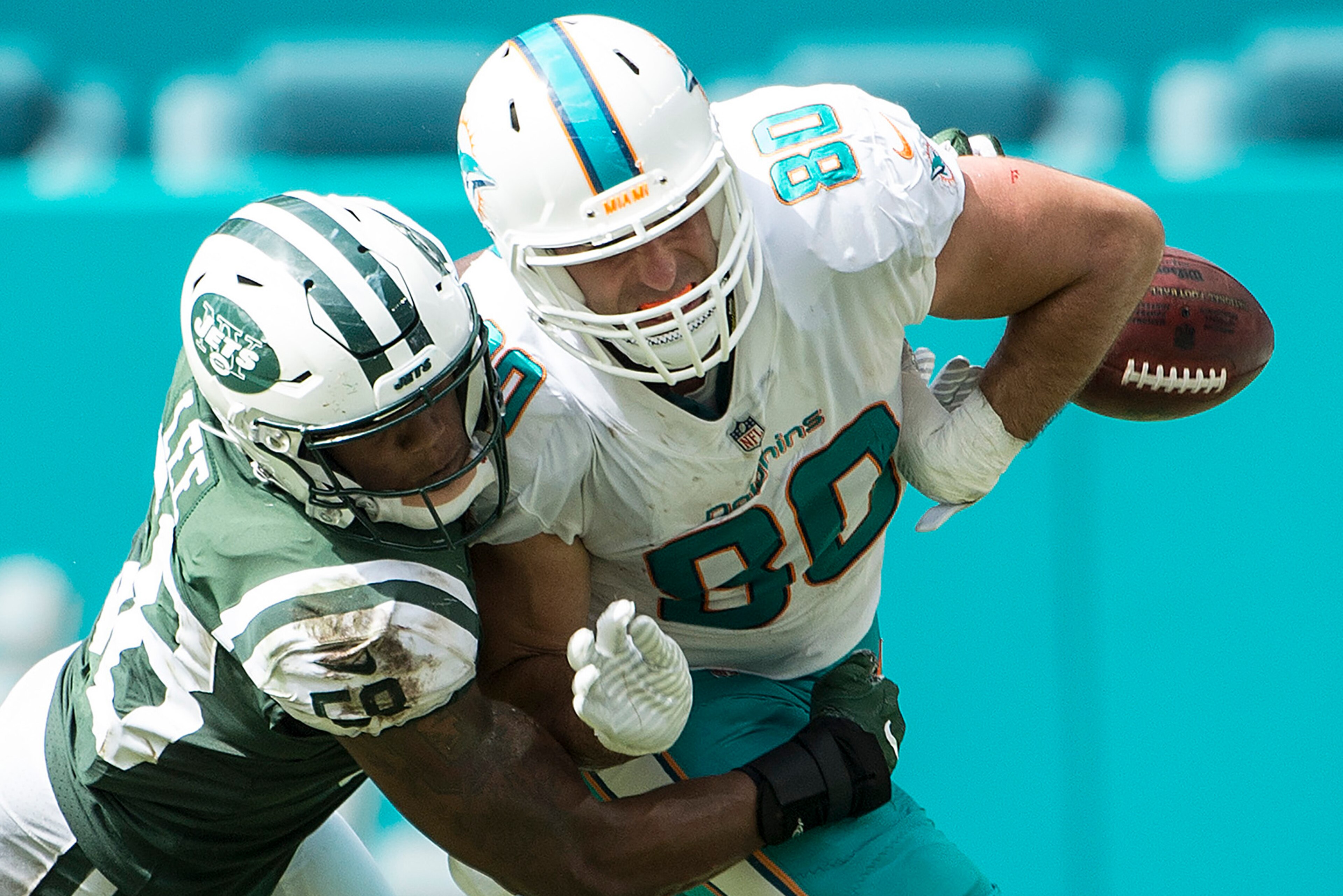 MIAMI GARDENS, FL - OCTOBER 22: Tight end Anthony Fasano of the Miami Dolphins catches a pass and fumbles as he is tackled by Darron Lee #58 of the New York Jets during a NFL game at Hard Rock Stadium on October 22, 2017 in Miami Gardens, Florida. (Phot MIAMI GARDENS, FL - OCTOBER 22: Tight end Anthony Fasano of the Miami Dolphins catches a pass and fumbles as he is tackled by Darron Lee #58 of the New York Jets during a NFL game at Hard Rock Stadium on October 22, 2017 in Miami Gardens, Florida. (Phot