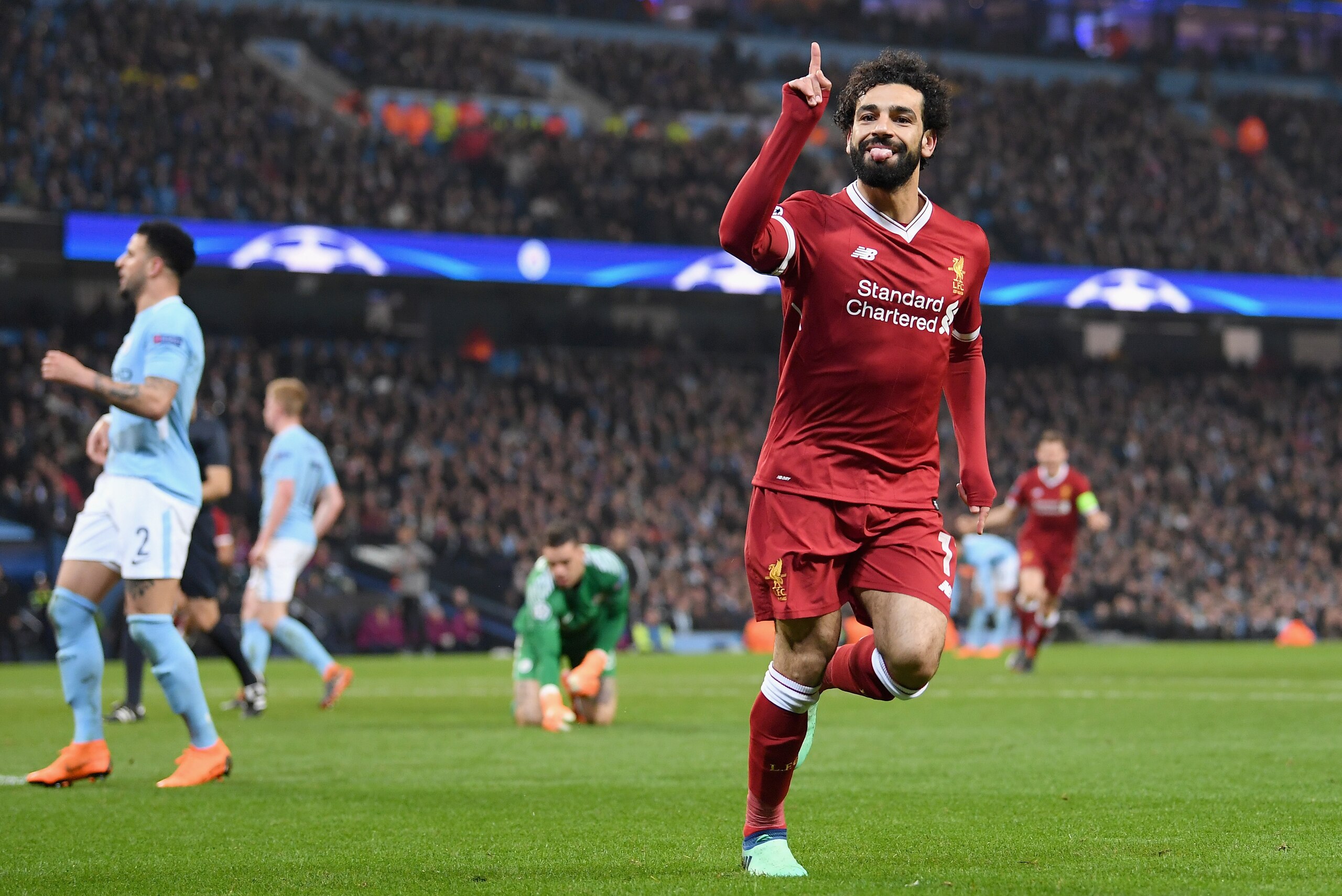 MANCHESTER, ENGLAND - APRIL 10:  Mohamed Salah of Liverpool celebrates after scoring his sides first goal during the UEFA Champions League Quarter Final Second Leg match between Manchester City and Liverpool at Etihad Stadium on April 10, 2018 in Manchest