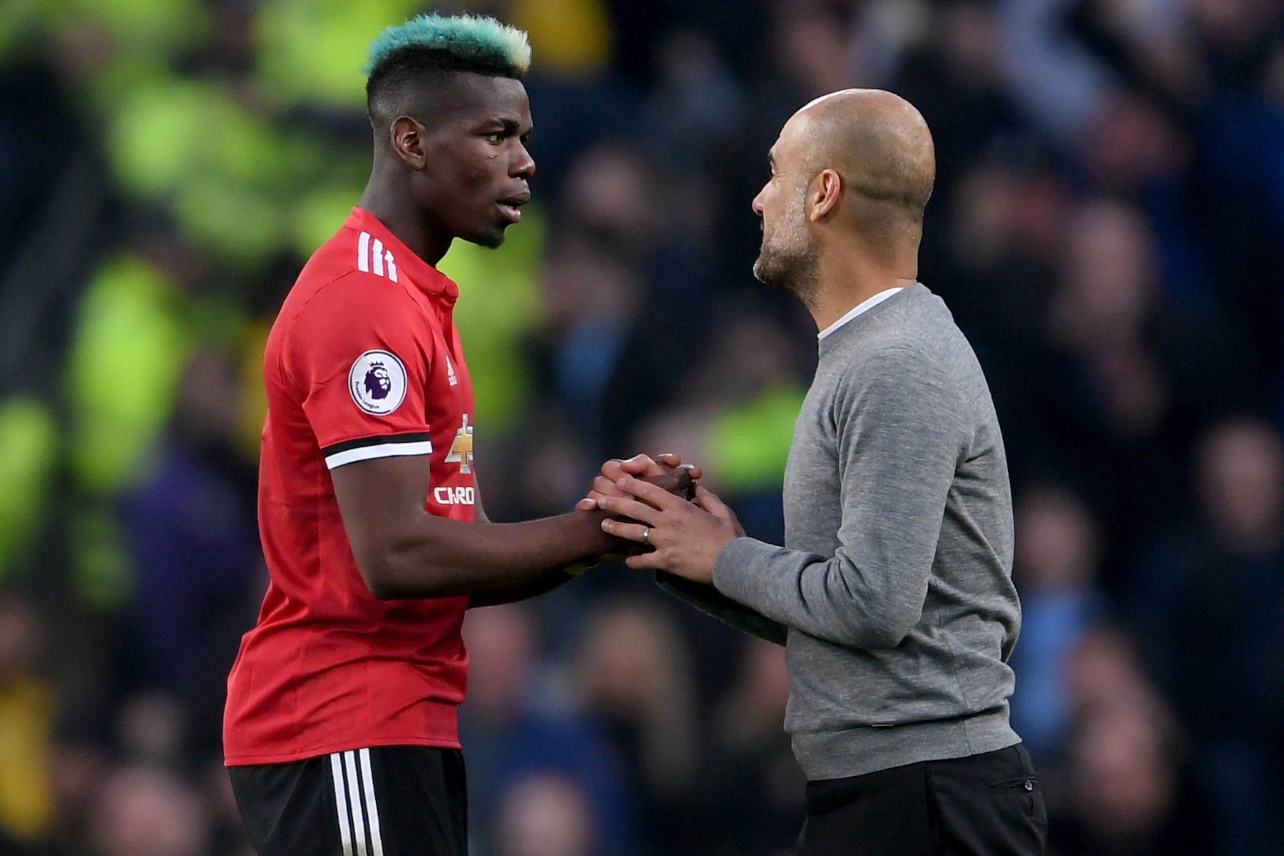 MANCHESTER, ENGLAND - APRIL 07:  Paul Pogba of Manchester United speaks with Josep Guardiola, Manager of Manchester City after the Premier League match between Manchester City and Manchester United at Etihad Stadium on April 7, 2018 in Manchester, England