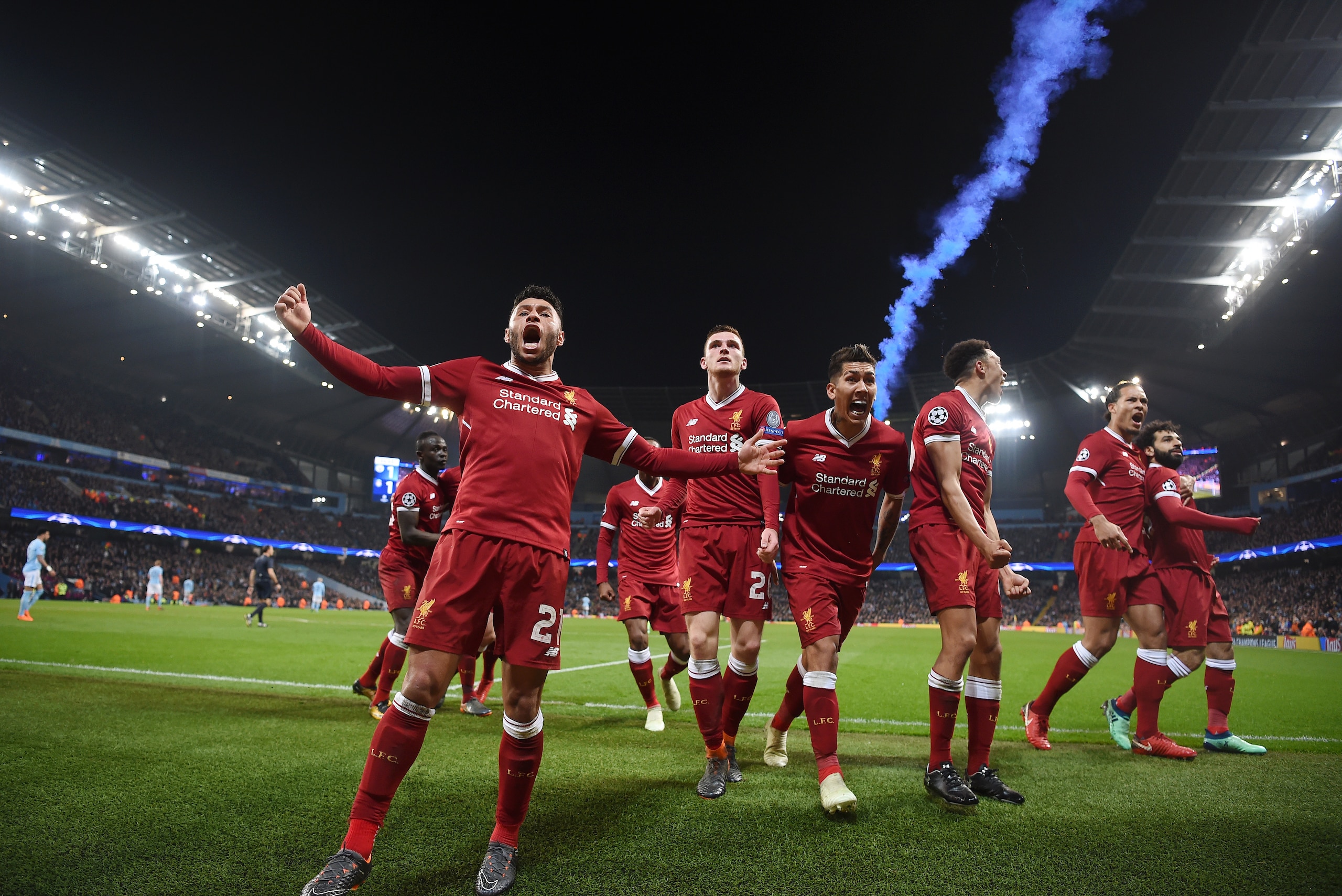 MANCHESTER, ENGLAND - APRIL 10:  l-r Alex Oxlade-Chamberlain, Andy Robertson, Roberto Firmino, Trent Alexander-Arnold, Virgil Van Dijk and goal scorer, Mohamed Salah of Liverpool celebrate the their first goal during the Quarter Final Second Leg match bet