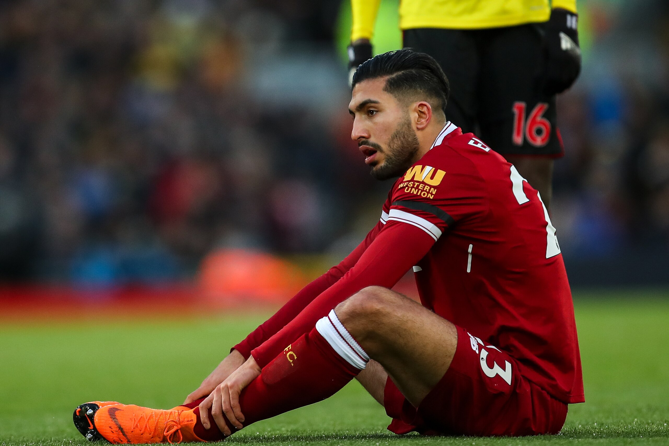 LIVERPOOL, ENGLAND - MARCH 17: Emre Can of Liverpool picks up an injury which results in him being taken off during the Premier League match between Liverpool and Watford at Anfield on March 17, 2018 in Liverpool, England. (Photo by Robbie Jay Barratt - A