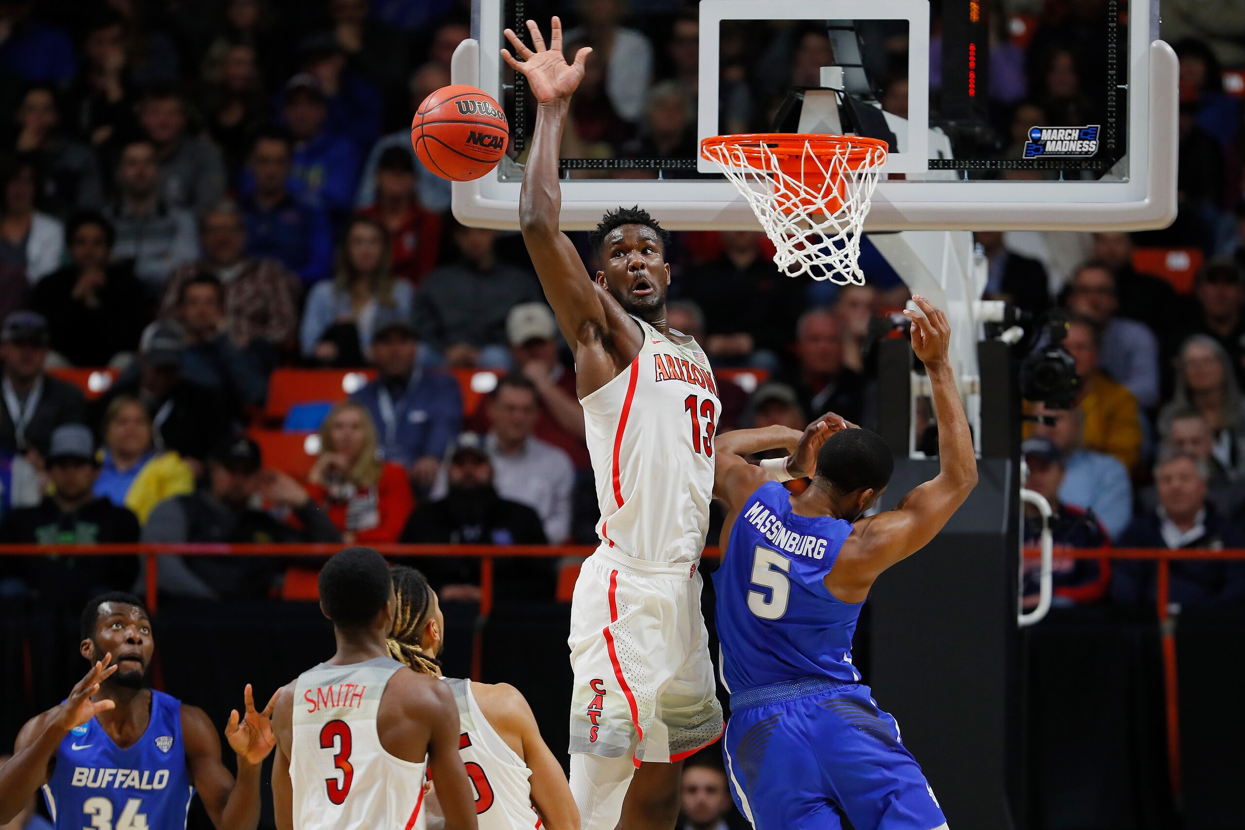 BOISE, ID - MARCH 15:  Deandre Ayton #13 of the Arizona Wildcats battles for the ball against CJ Massinburg #5 of the Buffalo Bulls in the second half during the first round of the 2018 NCAA Men's Basketball Tournament at Taco Bell Arena on March 15, 2018