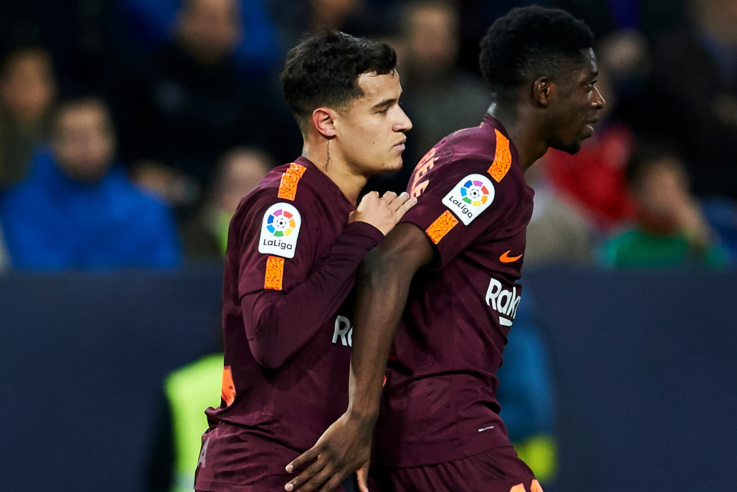 MALAGA, SPAIN - MARCH 10:  Philippe Coutinho of FC Barcelona celebrates with his teammates Ousmane Dembele of FC Barcelona after scoring his team's second goal during the La Liga match between Malaga and Barcelona at Estadio La Rosaleda on March 10, 2018 