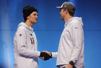ST PAUL, MN - JANUARY 29:  Tom Brady #12 of the New England Patriots and Nick Foles #9 of the Philadelphia Eagles shake hands during Super Bowl Media Day at Xcel Energy Center on January 29, 2018 in St Paul, Minnesota.  Super Bowl LII will be played betwe