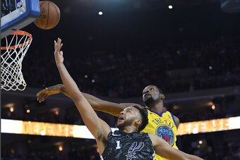 OAKLAND, CA - MARCH 08:  Kyle Anderson #1 of the San Antonio Spurs goes up for a layup and has his shot challenged by Kevin Durant #35 of the Golden State Warriors during an NBA basketball game at ORACLE Arena on March 8, 2018 in Oakland, California. NOTE