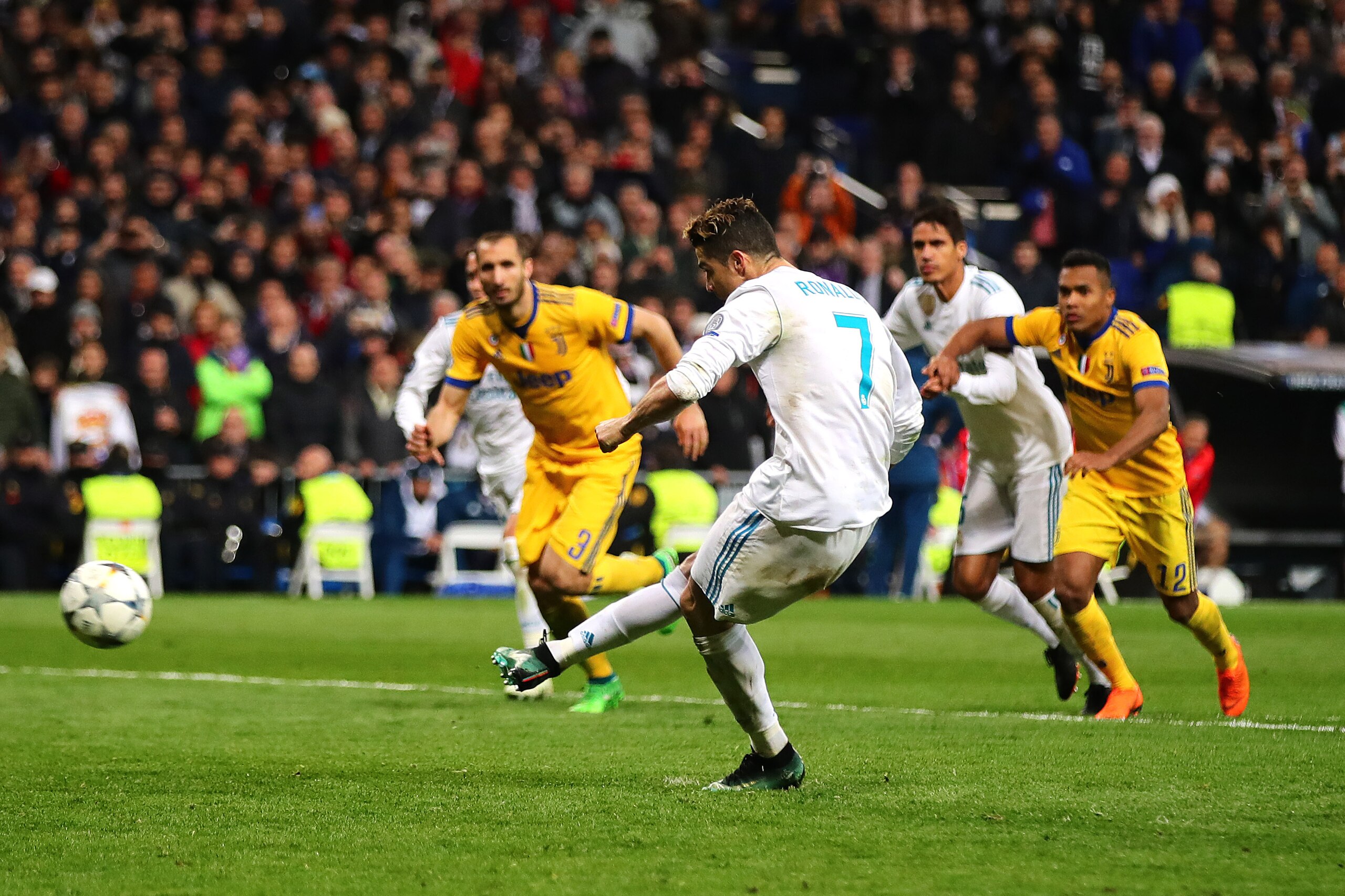 MADRID, SPAIN - APRIL 11: Cristiano Ronaldo of Real Madrid scores his side's first goal from the penalty spot during the UEFA Champions League Quarter Final, second leg match between Real Madrid and Juventus at Estadio Santiago Bernabeu on April 11, 2018 