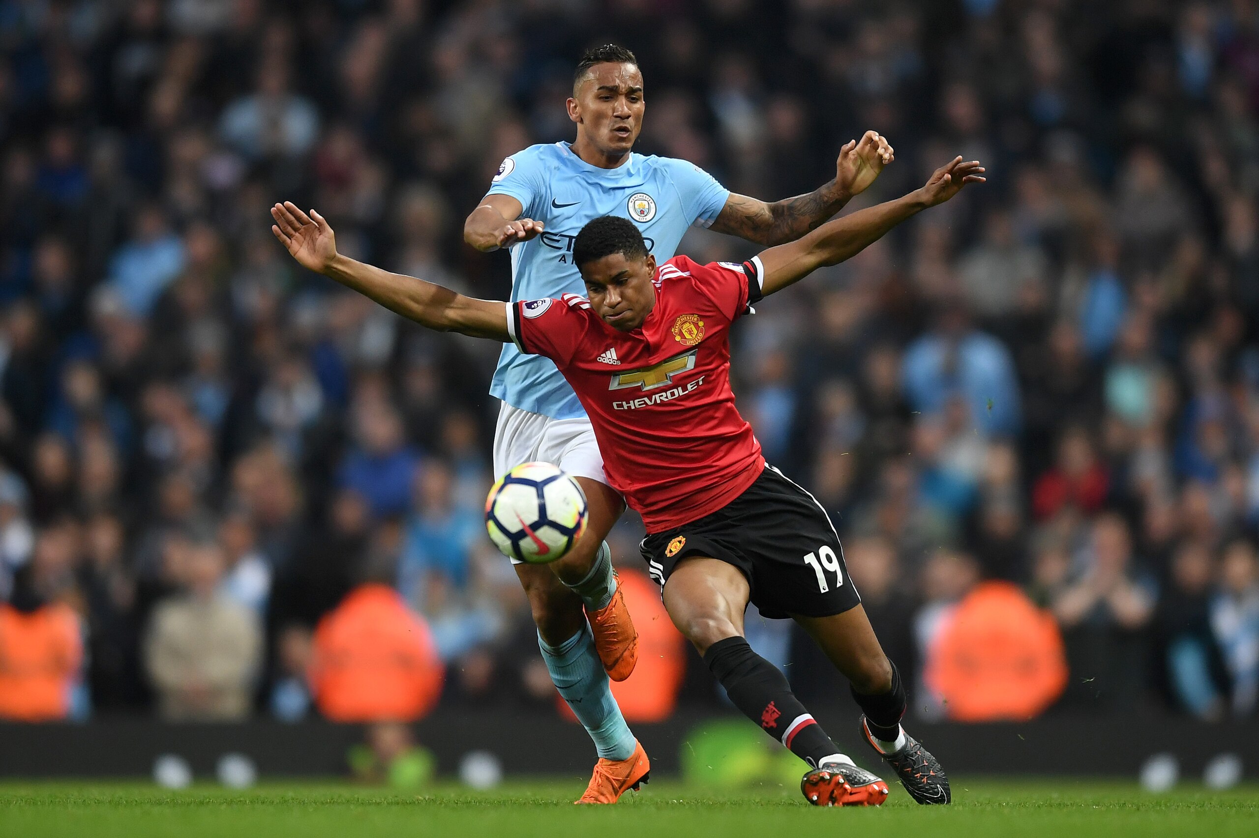 MANCHESTER, ENGLAND - APRIL 07:  Marcus Rashford of Manchester United is challenged by Danilo of Manchester City during the Premier League match between Manchester City and Manchester United at Etihad Stadium on April 7, 2018 in Manchester, England.  (Pho