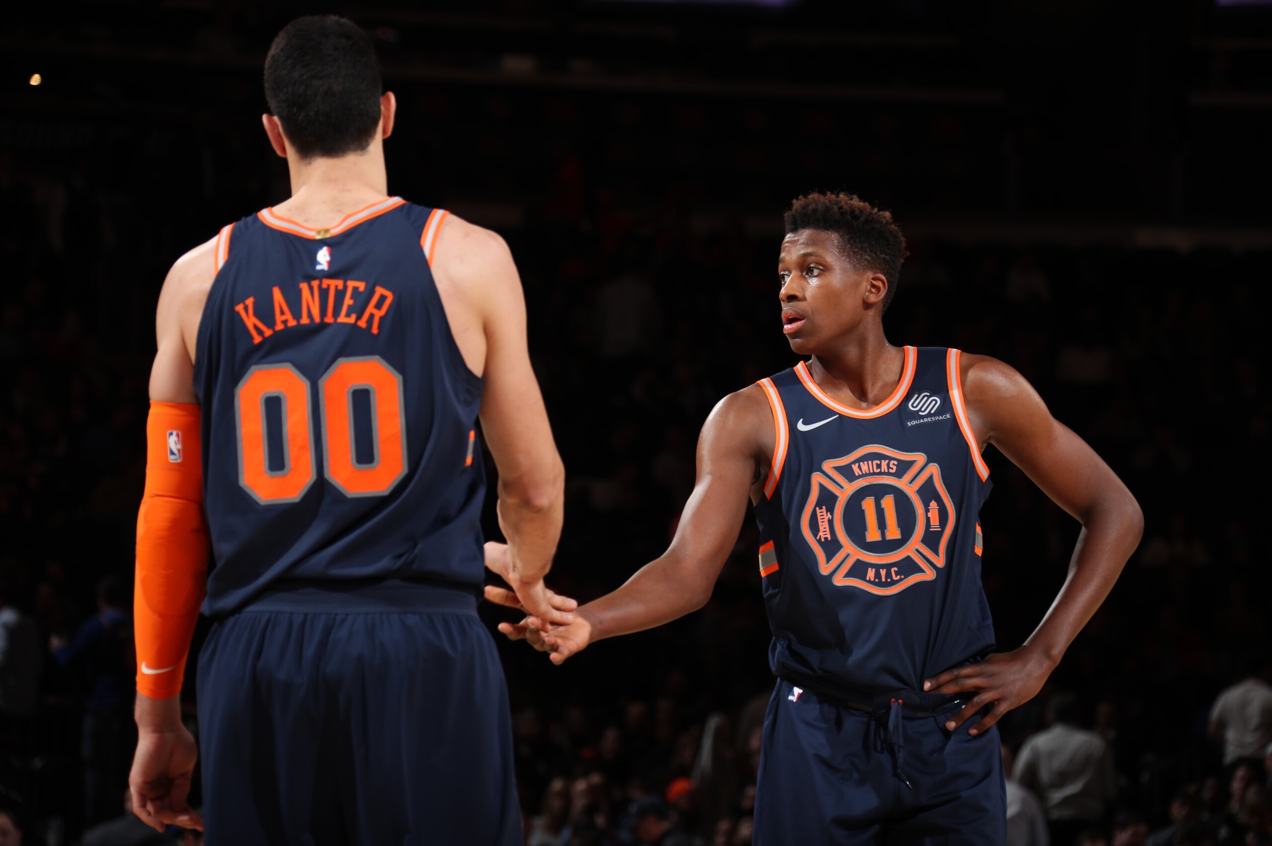 NEW YORK, NY - JANUARY 30:  Frank Ntilikina #11 and Enes Kanter #00 of the New York Knicks high five during the game against the Brooklyn Nets on January 30, 2018 at Madison Square Garden in New York City, New York.  NOTE TO USER: User expressly acknowled