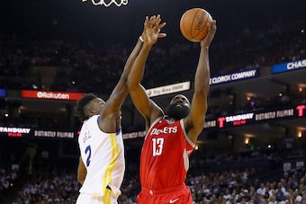 OAKLAND, CA - OCTOBER 17:  James Harden #13 of the Houston Rockets drives on Jordan Bell #2 of the Golden State Warriors at ORACLE Arena on October 17, 2017 in Oakland, California.  NOTE TO USER: User expressly acknowledges and agrees that, by downloading