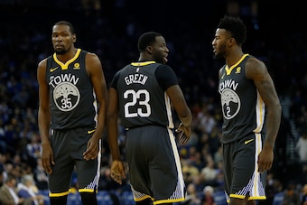 OAKLAND, CA - DECEMBER 23: Kevin Durant #35, Draymond Green #23 and Jordan Bell #2 of the Golden State Warriors at ORACLE Arena on December 23, 2017 in Oakland, California. NOTE TO USER: User expressly acknowledges and agrees that, by downloading and or u