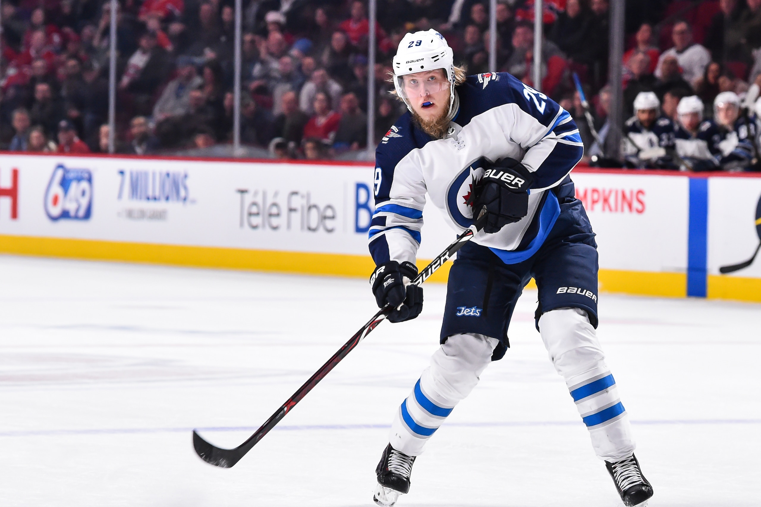 MONTREAL, QC - APRIL 03:  Patrik Laine #29 of the Winnipeg Jets plays the puck against the Montreal Canadiens during the NHL game at the Bell Centre on April 3, 2018 in Montreal, Quebec, Canada.  The Winnipeg Jets defeated the Montreal Canadiens 5-4 in ov