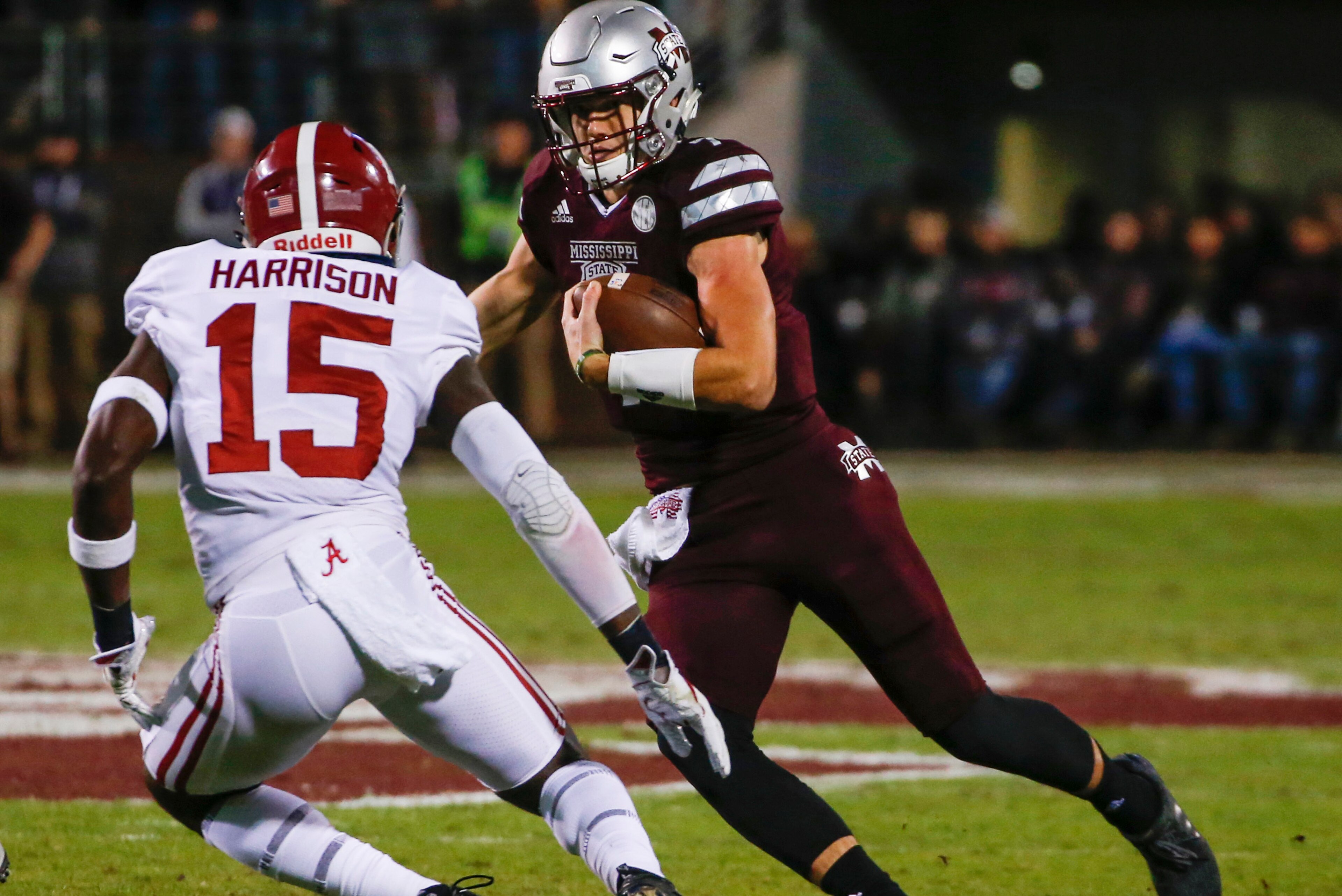 STARKVILLE, MS - NOVEMBER 11: Nick Fitzgerald #7 of the Mississippi State Bulldogs carries the ball as he tries to get around Ronnie Harrison #15 of the Alabama Crimson Tide during the first half of an NCAA football game at Davis Wade Stadium on November STARKVILLE, MS - NOVEMBER 11: Nick Fitzgerald #7 of the Mississippi State Bulldogs carries the ball as he tries to get around Ronnie Harrison #15 of the Alabama Crimson Tide during the first half of an NCAA football game at Davis Wade Stadium on November
