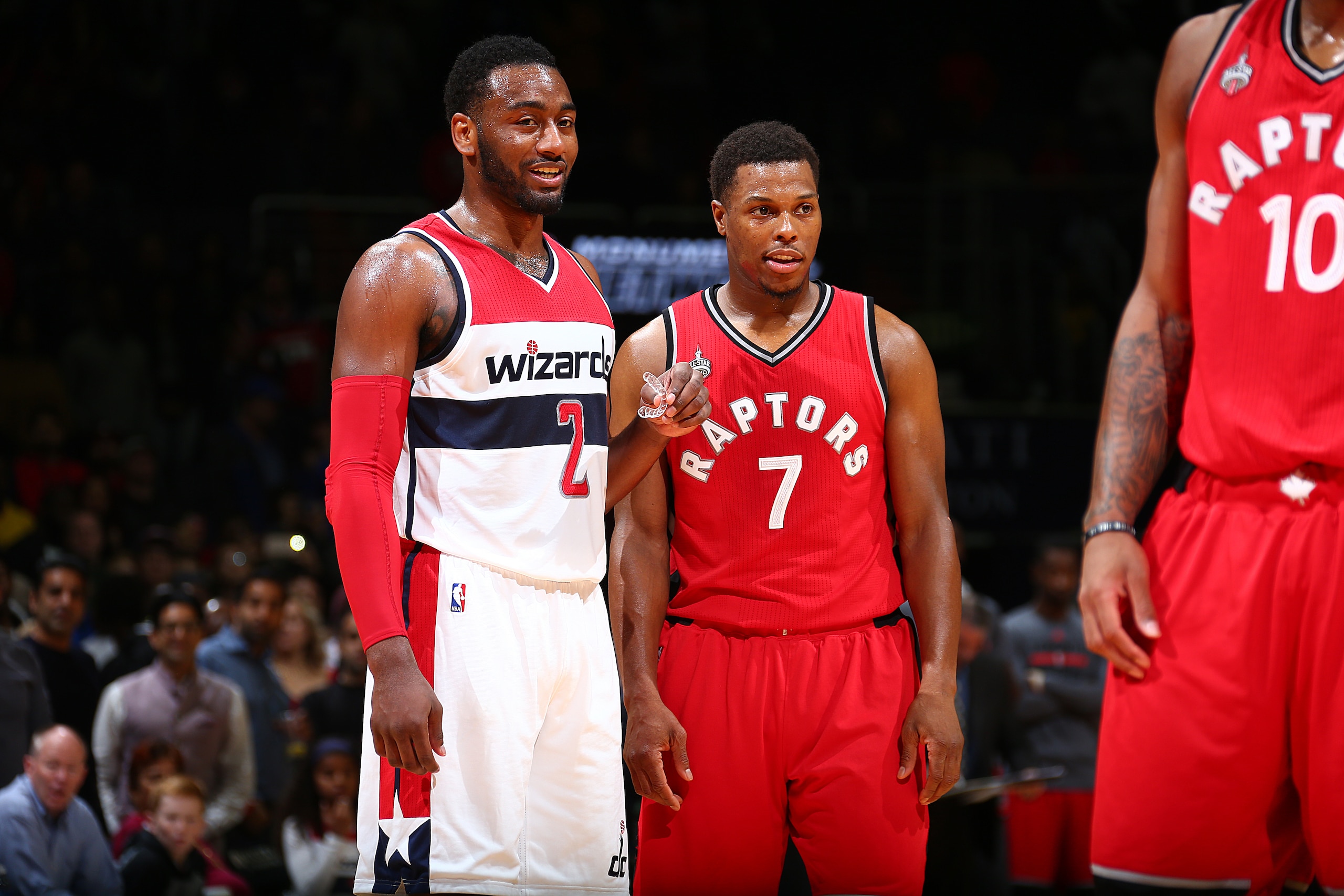 WASHINGTON, DC - NOVEMBER 28: John Wall #2 of the Washington Wizards talks with Kyle Lowry #7 of the Toronto Raptors during the game on November 28, 2015 at Verizon Center in Washington, DC. NOTE TO USER: User expressly acknowledges and agrees that, by WASHINGTON, DC - NOVEMBER 28: John Wall #2 of the Washington Wizards talks with Kyle Lowry #7 of the Toronto Raptors during the game on November 28, 2015 at Verizon Center in Washington, DC. NOTE TO USER: User expressly acknowledges and agrees that, by