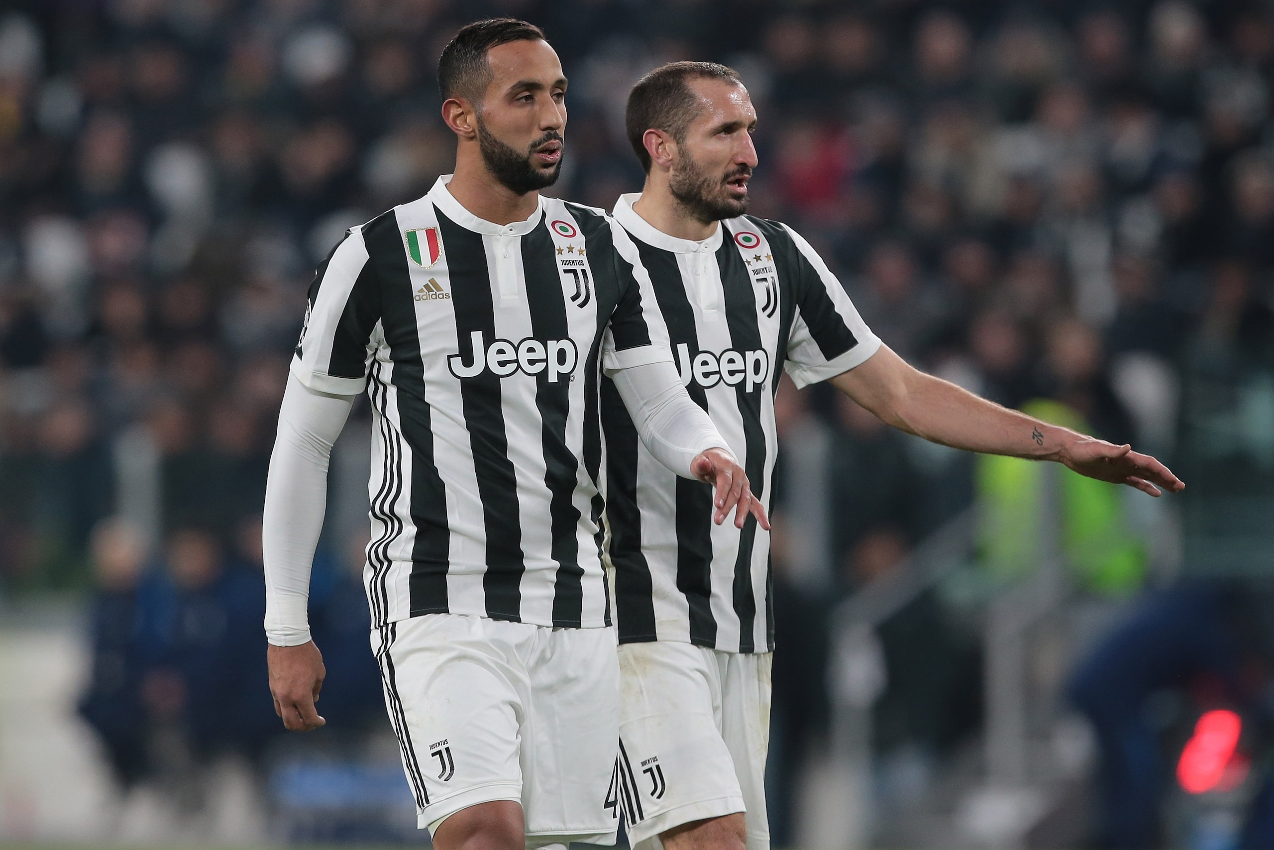 TURIN, ITALY - FEBRUARY 13:  Medhi Benatia (L) and Giorgio Chiellini of Juventus FC look on during the UEFA Champions League Round of 16 First Leg  match between Juventus and Tottenham Hotspur at Allianz Stadium on February 13, 2018 in Turin, Italy.  (Pho