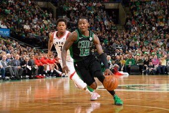 BOSTON, MA - MARCH 31: Terry Rozier #12 of the Boston Celtics handles the ball against the Toronto Raptors on March 31, 2018 at the TD Garden in Boston, Massachusetts. NOTE TO USER: User expressly acknowledges and agrees that, by downloading and or using 