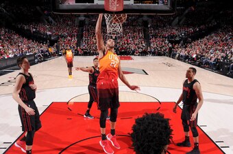 PORTLAND, OR - APRIL 11: Rudy Gobert #27 of the Utah Jazz dunks against the Portland Trail Blazers on April 11, 2018 at the Moda Center in Portland, Oregon. NOTE TO USER: User expressly acknowledges and agrees that, by downloading and or using this Photog