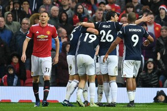 Manchester United's Serbian midfielder Nemanja Matic (L) who's error led to the goal, reacts as West Brom players celebrate their opening goal during the English Premier League football match between Manchester United and West Bomwich Albion at Old Traffo