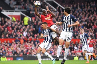 MANCHESTER, ENGLAND - APRIL 15: Paul Pogba of Manchester United handles the ball and a freekick is given to West Bromwich Albion during the Premier League match between Manchester United and West Bromwich Albion at Old Trafford on April 15, 2018 in Manche