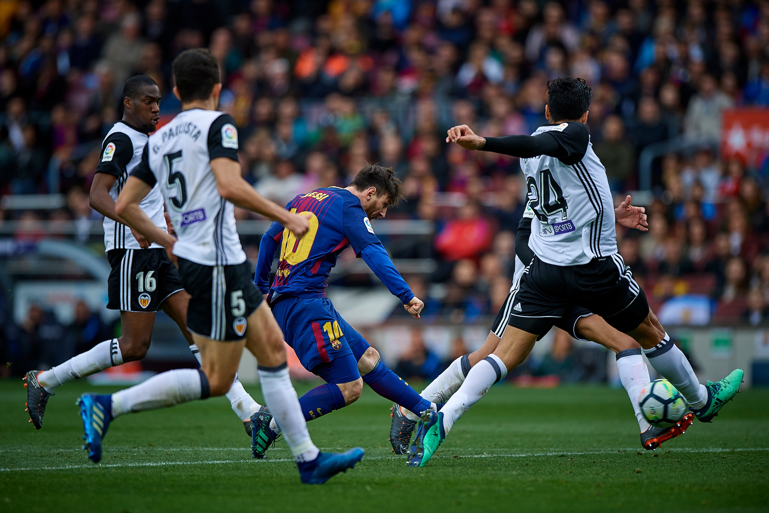 BARCELONA, SPAIN - APRIL 14:  Lionel Messi (C) of Barcelona surrounded by players of Valencia during the La Liga match between Barcelona and Valencia at Camp Nou on April 14, 2018 in Barcelona, Spain.  (Photo by Quality Sport Images/Getty Images)