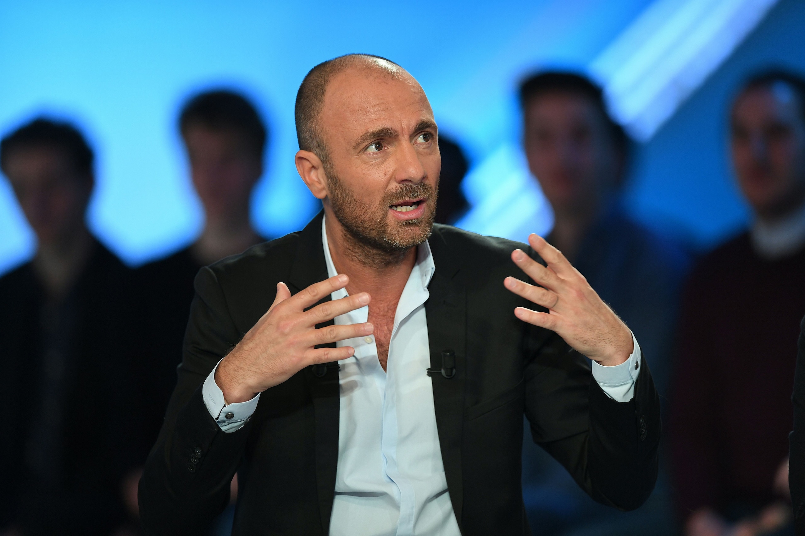 Former French international football player turned sports consultant, Christophe Dugarry speaks prior to the start of the TV show 'Canal Football Club' on March 27, 2016 in Paris.  / AFP / FRANCK FIFE        (Photo credit should read FRANCK FIFE/AFP/Getty