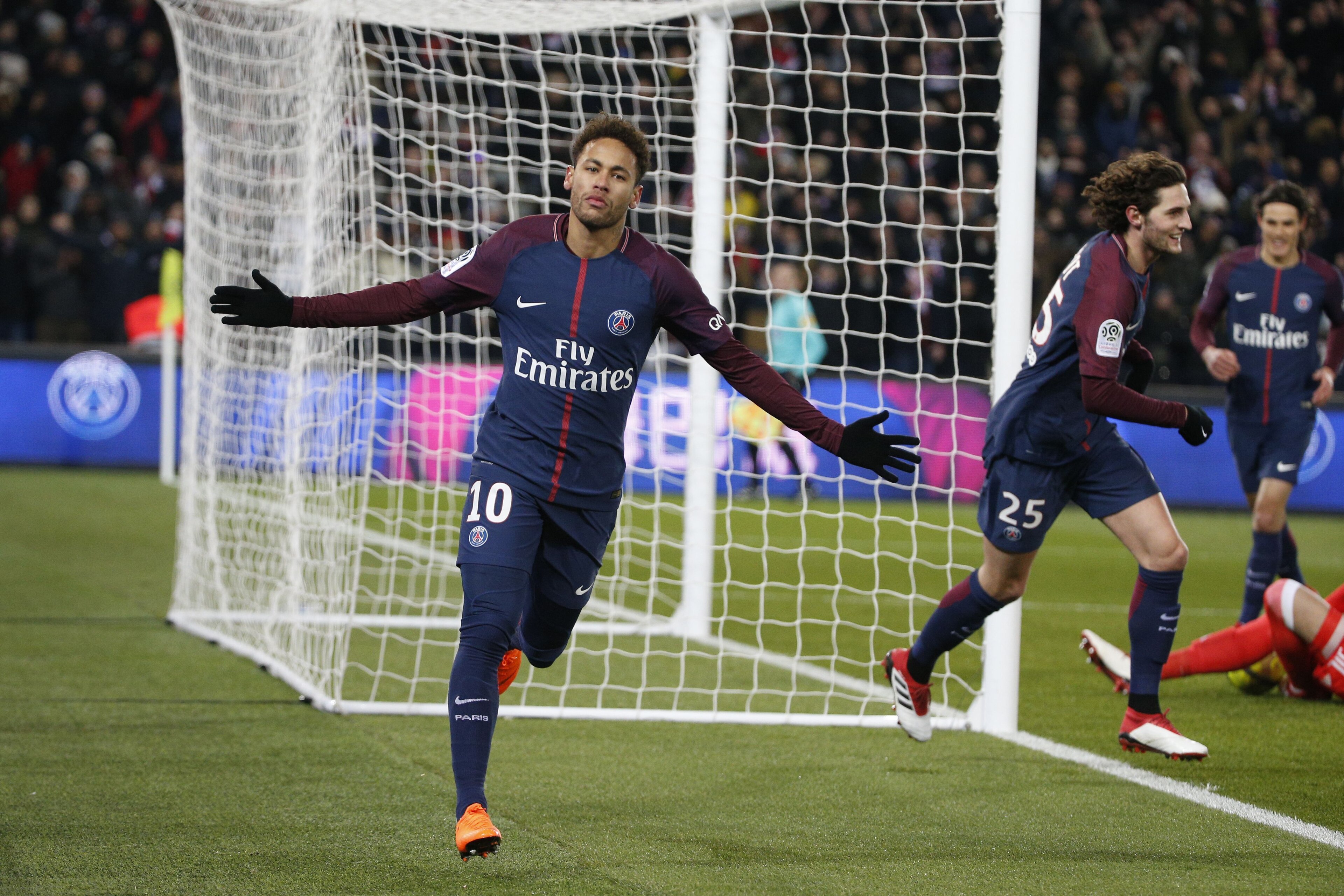 Paris Saint-Germain's Brazilian forward Neymar Jr celebrates after Marseille's Portuguese defender Rolando (unseen) scored an own goal after a kick of Neymar during the French L1 football match between Paris Saint-Germain (PSG) and Marseille (OM) at the P