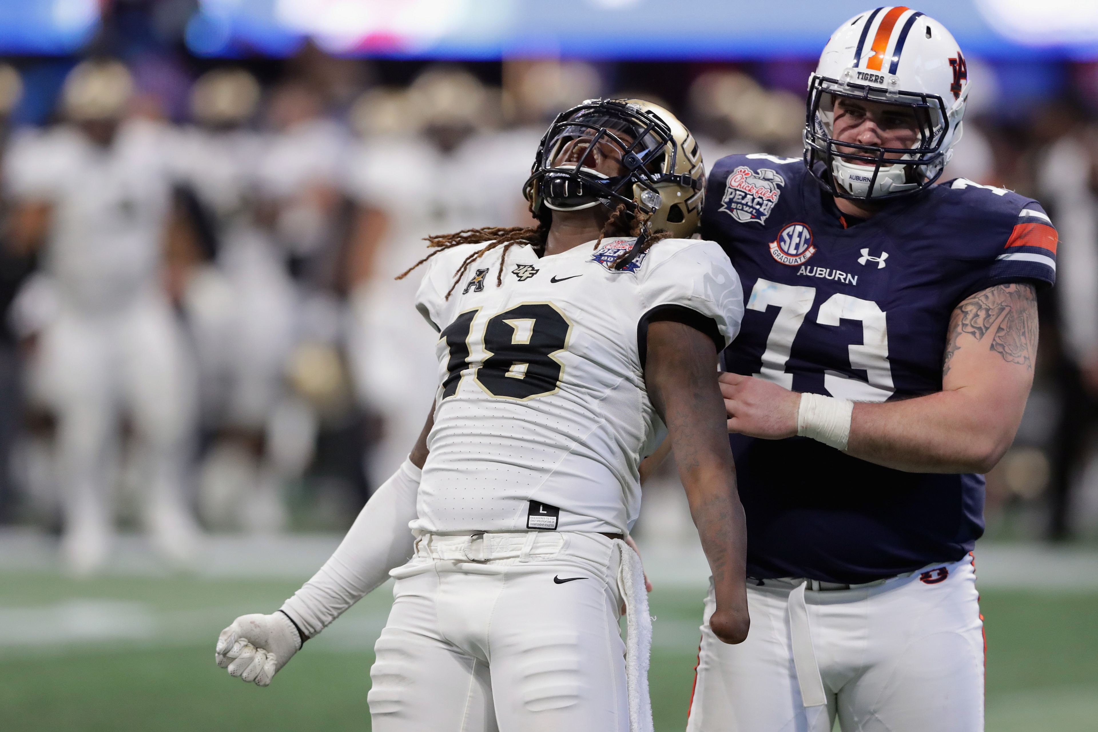 ATLANTA, GA - JANUARY 01: Shaquem Griffin #18 of the UCF Knights celebrates after sacking Jarrett Stidham #8 of the Auburn Tigers (not pictured) in the third quarter during the Chick-fil-A Peach Bowl at Mercedes-Benz Stadium on January 1, 2018 in Atlanta ATLANTA, GA - JANUARY 01: Shaquem Griffin #18 of the UCF Knights celebrates after sacking Jarrett Stidham #8 of the Auburn Tigers (not pictured) in the third quarter during the Chick-fil-A Peach Bowl at Mercedes-Benz Stadium on January 1, 2018 in Atlanta