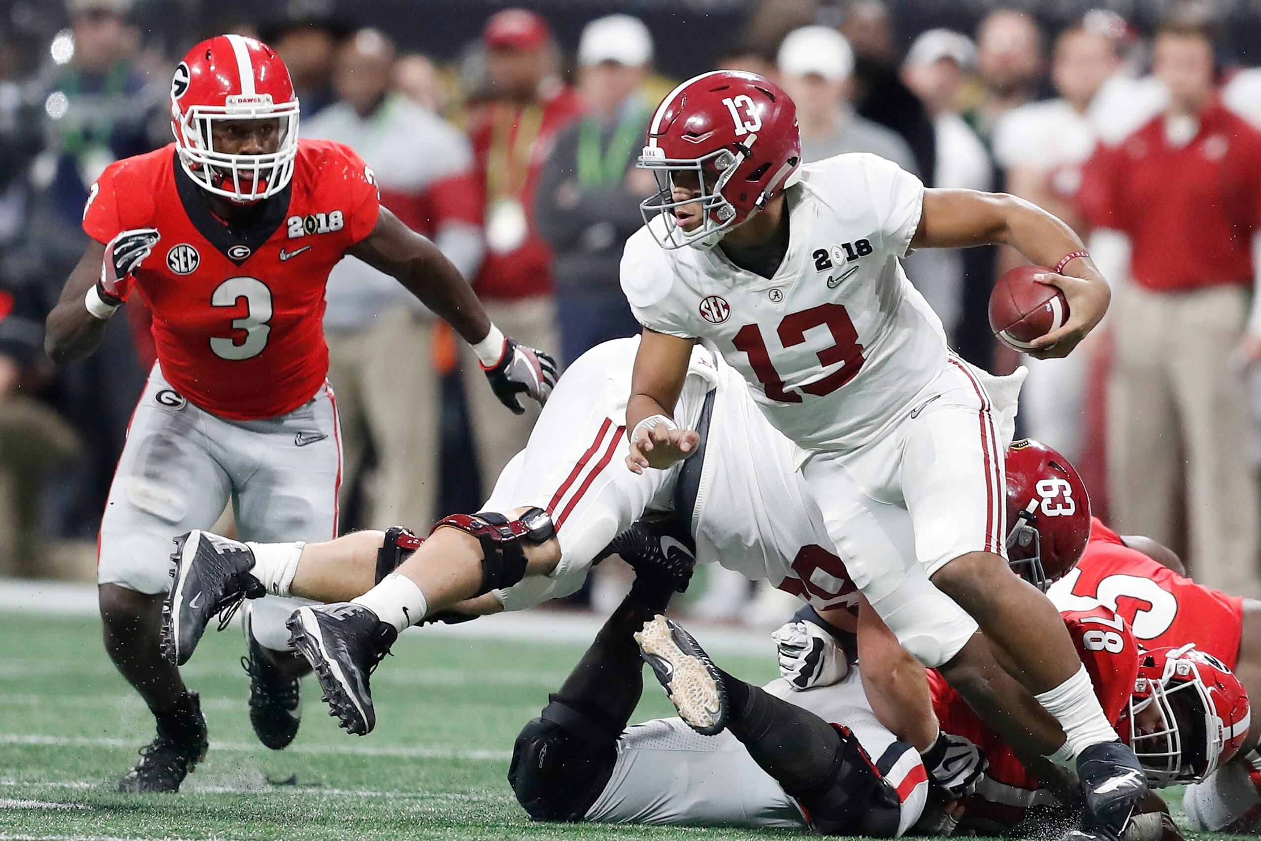 Tua Tagovailoa scrambles away from pressure in CFP title game against Georgia. Tua Tagovailoa scrambles away from pressure in CFP title game against Georgia.