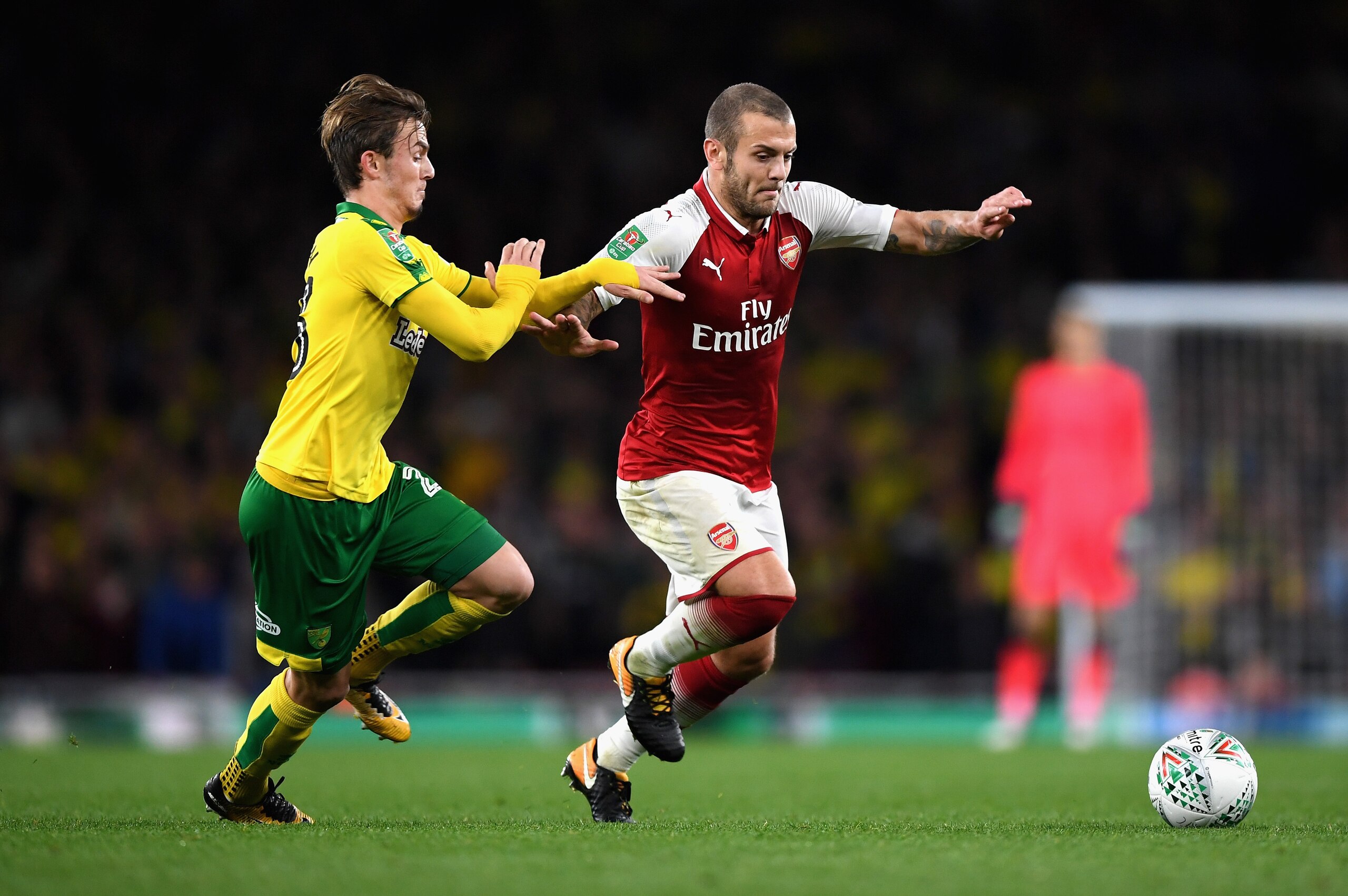 LONDON, ENGLAND - OCTOBER 24:  James Maddison of Norwich City and Jack Wilshere of Arsenal battle for possession during the Carabao Cup Fourth Round match between Arsenal and Norwich City at Emirates Stadium on October 24, 2017 in London, England.  (Photo
