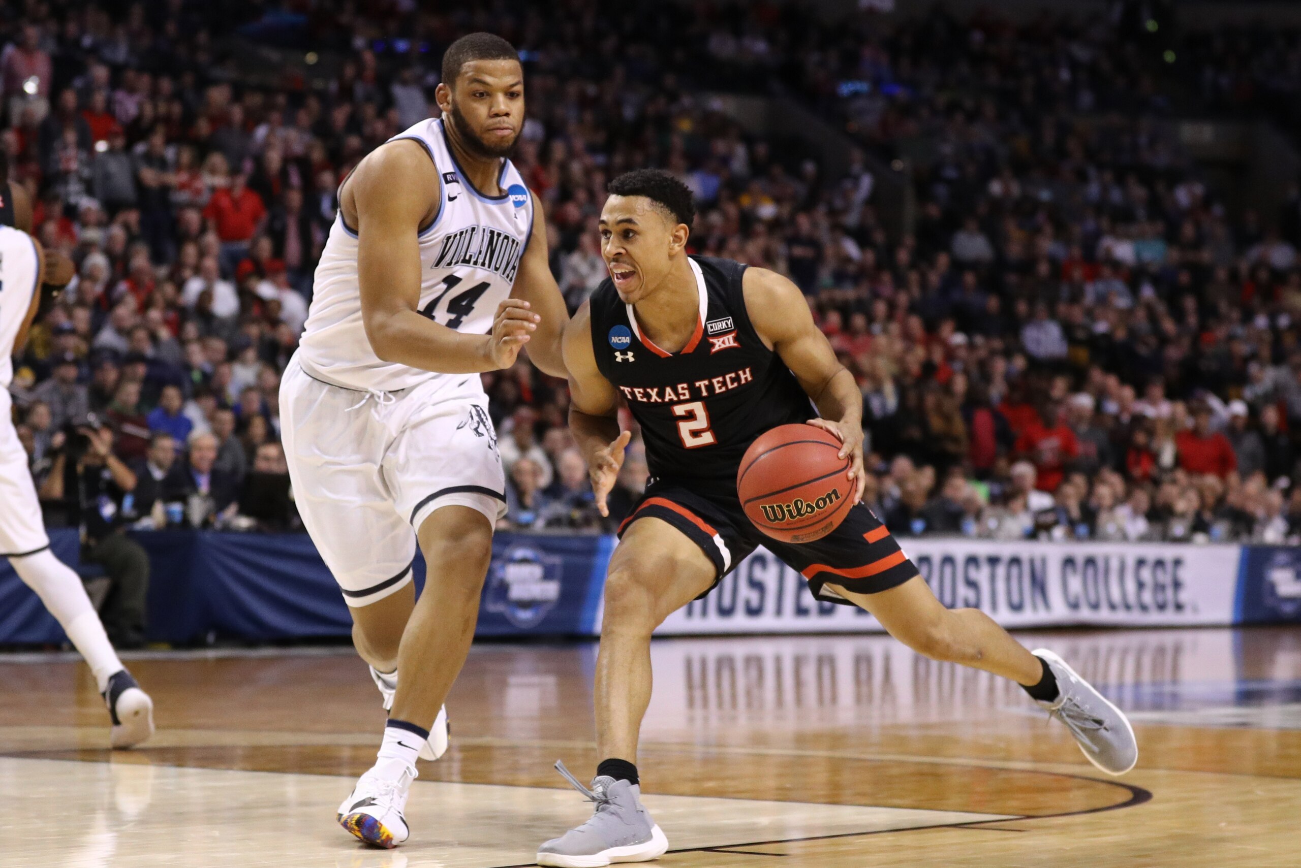 BOSTON, MA - MARCH 25: Zhaire Smith #2 of the Texas Tech Red Raiders is defended by Omari Spellman #14 of the Villanova Wildcats during the second half in the 2018 NCAA Men's Basketball Tournament East Regional at TD Garden on March 25, 2018 in Boston, M BOSTON, MA - MARCH 25: Zhaire Smith #2 of the Texas Tech Red Raiders is defended by Omari Spellman #14 of the Villanova Wildcats during the second half in the 2018 NCAA Men's Basketball Tournament East Regional at TD Garden on March 25, 2018 in Boston, M